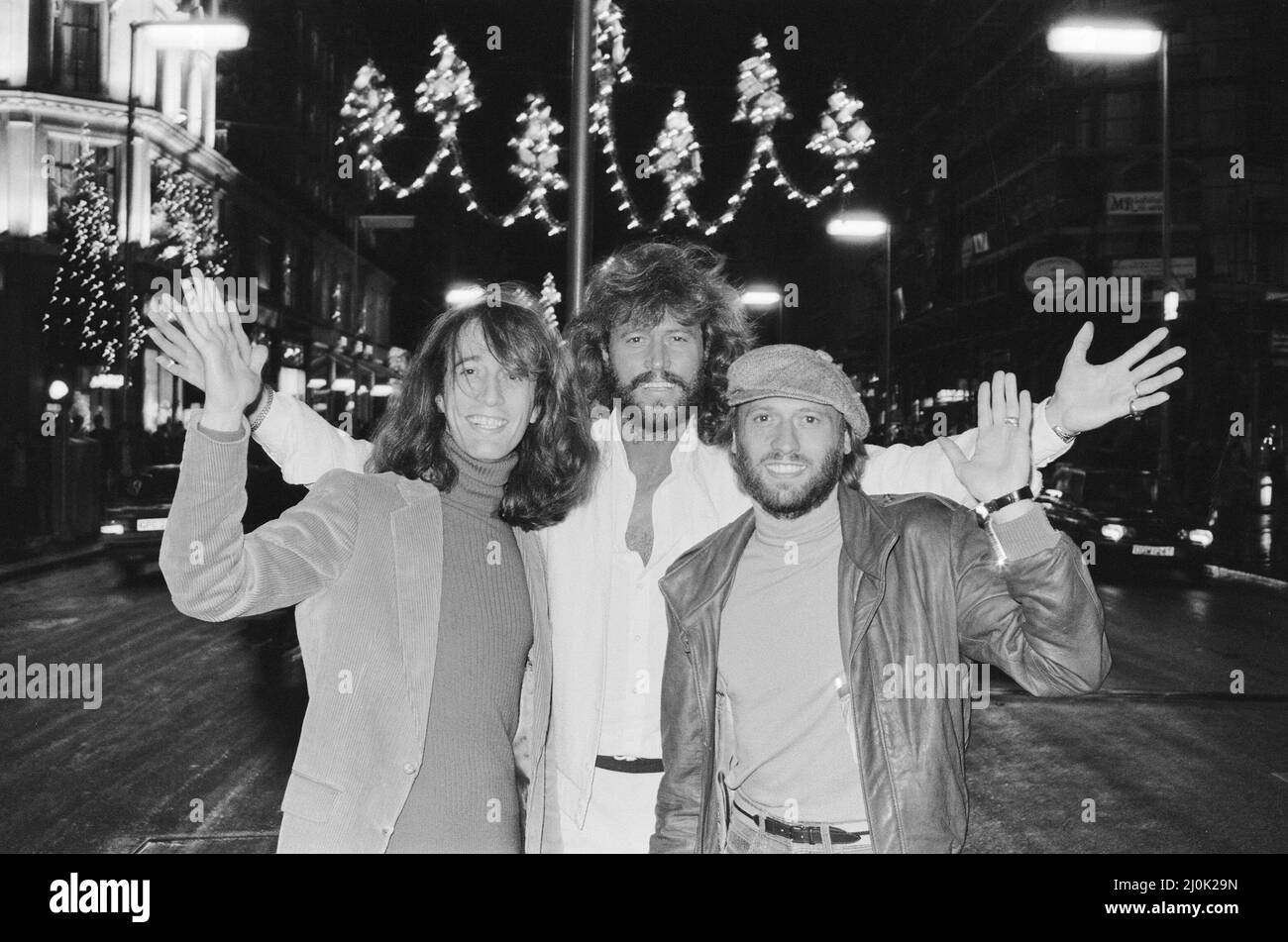The Bee Gees check out the christmas lights in Regent Street London 22nd November 1981.  From left to right:  Robin Gibb Barry Gibb Maurice Gibb Stock Photo