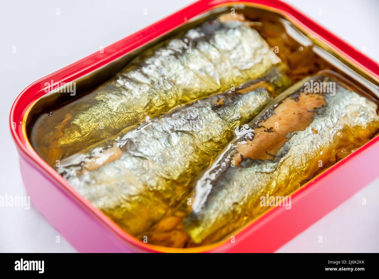 Tin of sardines in oil on white background Stock Photo - Alamy