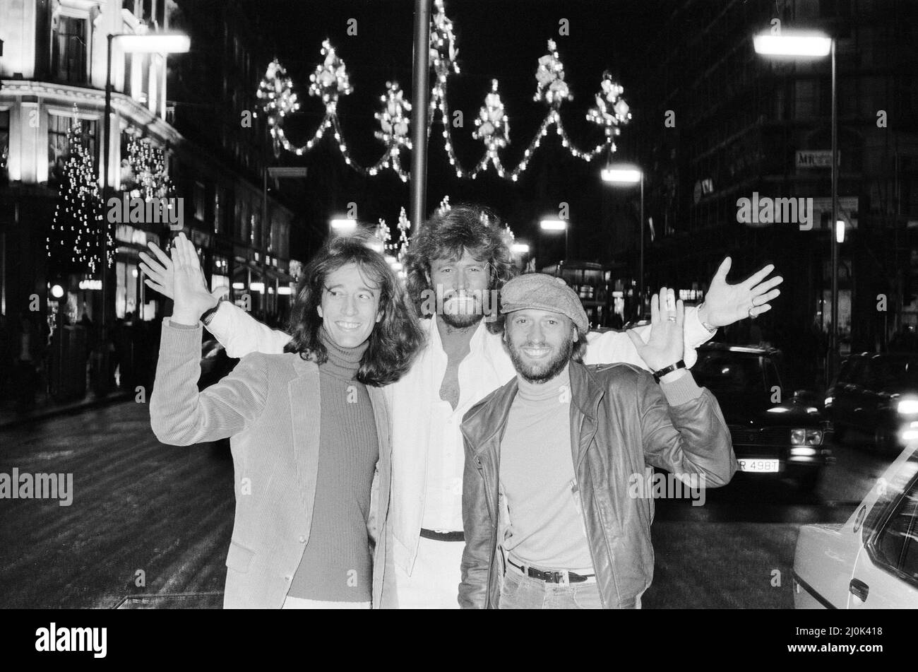 The Bee Gees check out the christmas lights in Regent Street London 22nd November 1981.  From left to right:  Robin Gibb Barry Gibb Maurice Gibb Stock Photo