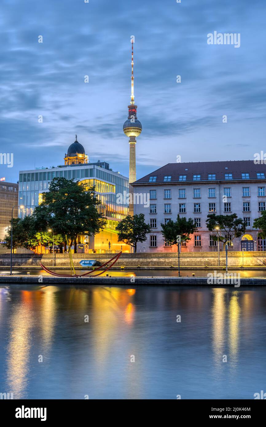 The river Spree in downtown Berlin with the famous TV Tower before sunrise Stock Photo