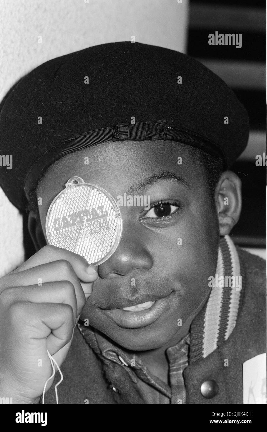 Musical Youth, British Jamaican pop / reggae group, at Capital Radio studios in London where they are helping to launch a road safety campaign involving glitter discs 8th October 1982.  Pictured: Kelvin Grant holding disc  Members of the group are: Freddie Waite a.k.a. Junior, Dennis Seaton, Patrick Waite, Michael Grant & Kelvin Grant Stock Photo