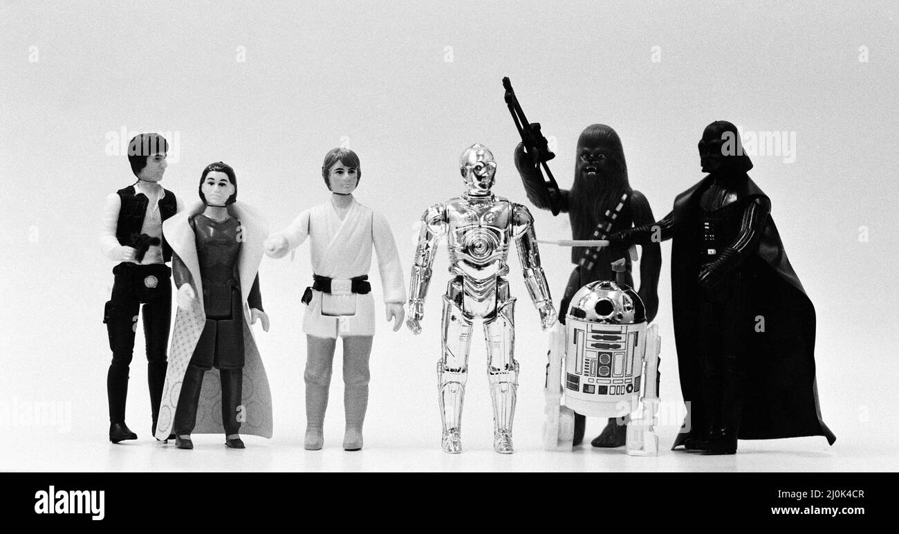 Star Wars toys. Figures from left to right, Han Solo, Leia Organa, Luke Skywalker, C-3PO, Chewbacca, R2-D2 and Darth Vader. 21st October 1982. Stock Photo