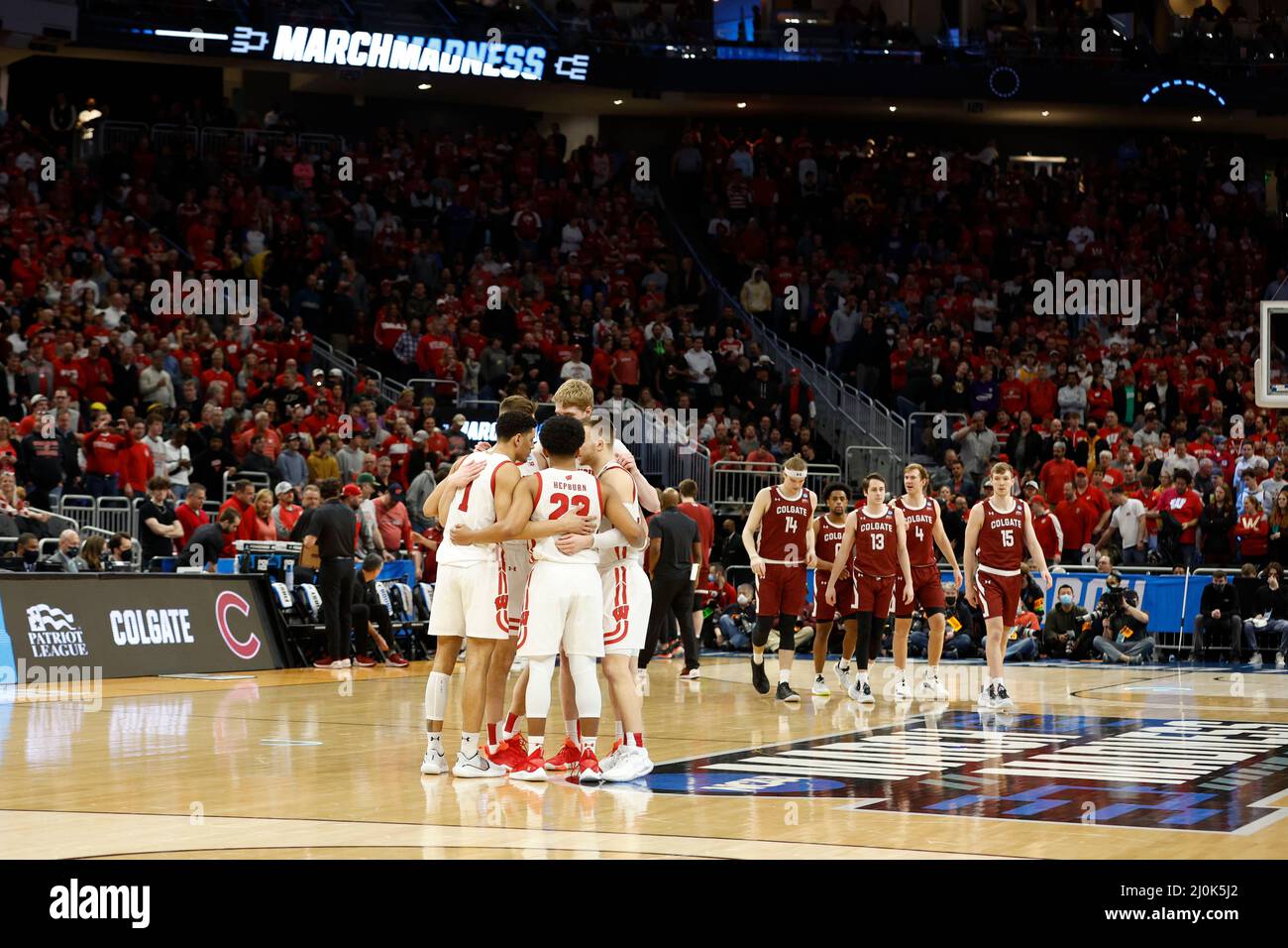 Milwaukee, WI, USA. 18th Mar, 2022. Wisconsin Badgers guard Johnny Davis (1), guard Chucky Hepburn (23), guard Brad Davison (34), forward Tyler Wahl (5), and forward Steven Crowl (22) huddle up before tipoff of the NCAA Men's March Madness Tournament basketball game between the Colgate Raiders and the Wisconsin Badgers at the Fiserv Forum in Milwaukee, WI. Darren Lee/CSM/Alamy Live News Stock Photo