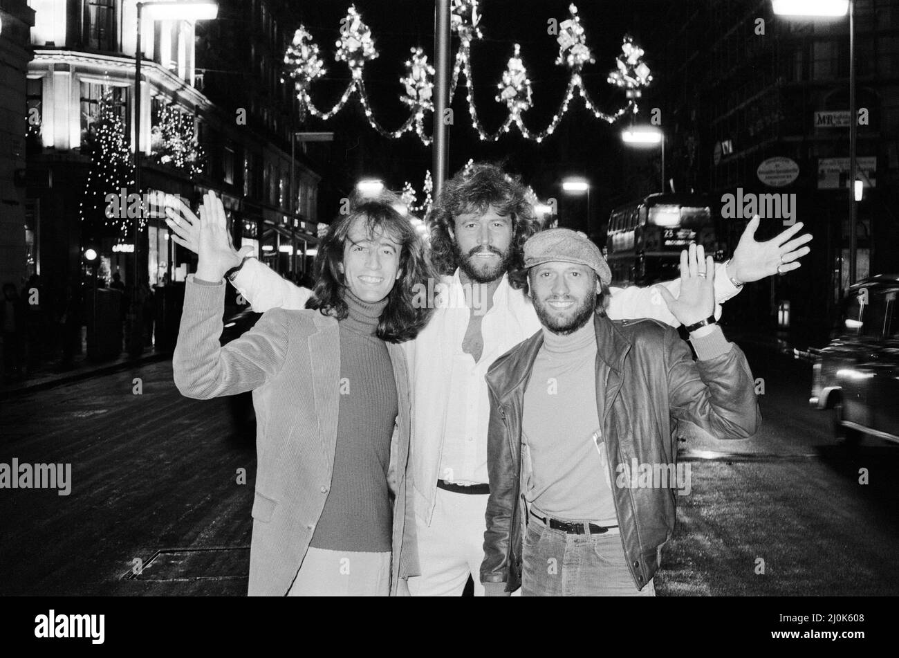The Bee Gees check out the christmas lights in Regent Street London 22nd November 1981. From left to right:  Robin Gibb Barry Gibb Maurice Gibb Stock Photo