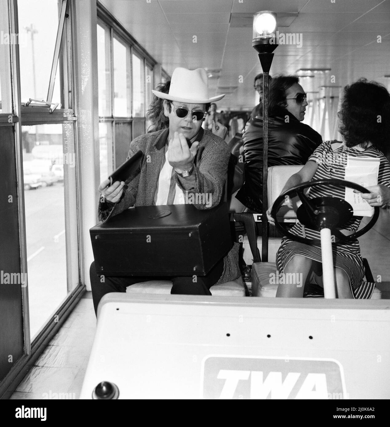 Elton John pictured at Heathrow airport. 1st June 1982 Stock Photo Alamy