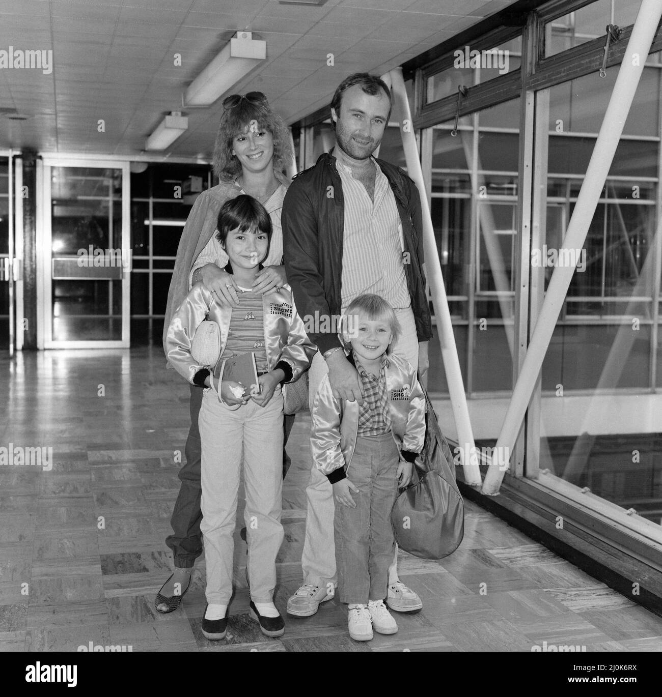 Phil Collins of pop group Genesis, with girlfriend Jill Tavelman and his children 10-year old Joely and 5-year-old Simon for a months tour of the states. 28th July 1982. Stock Photo