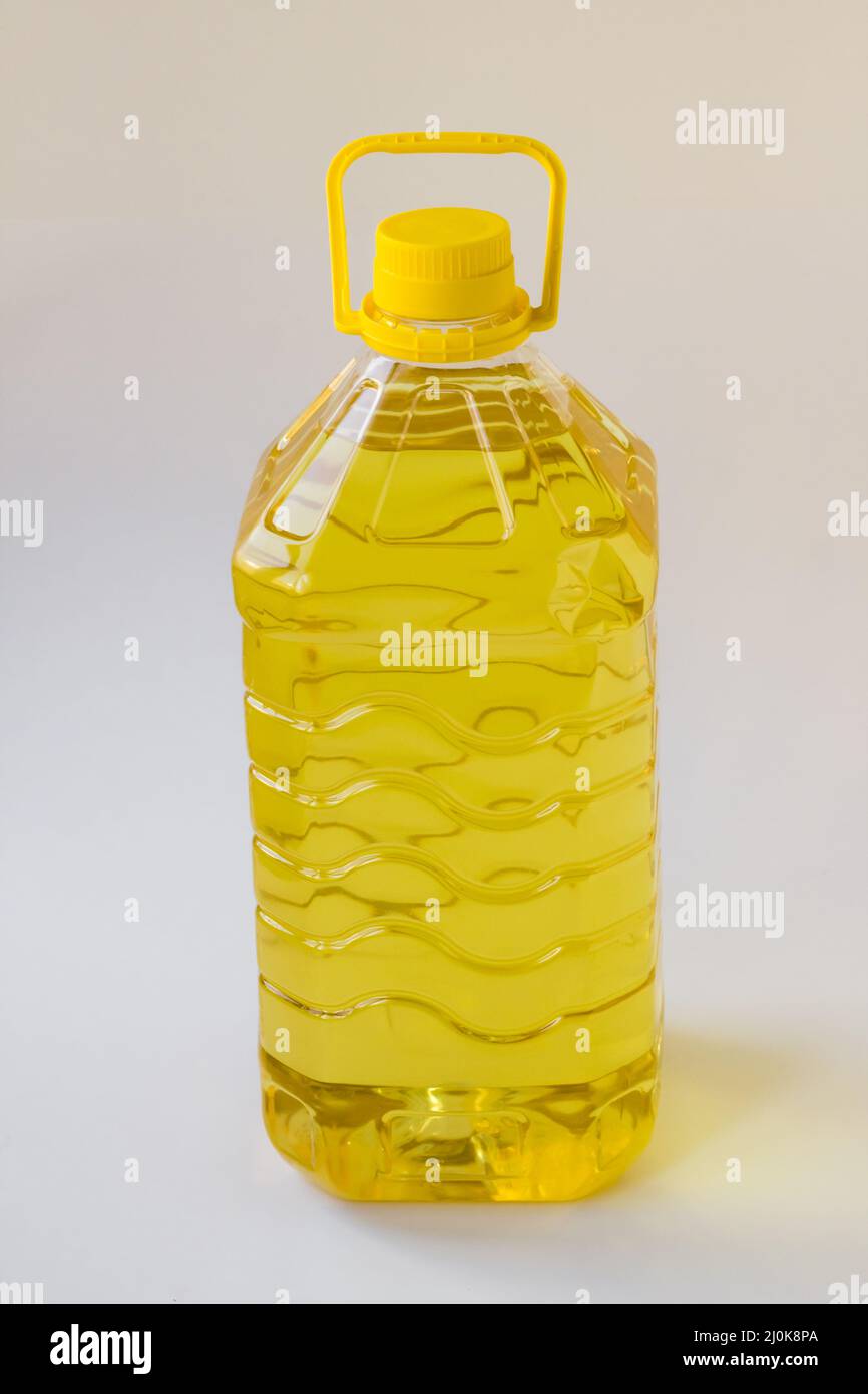 Five liter sunflower oil in a plastic bottle on white background,vertical image Stock Photo
