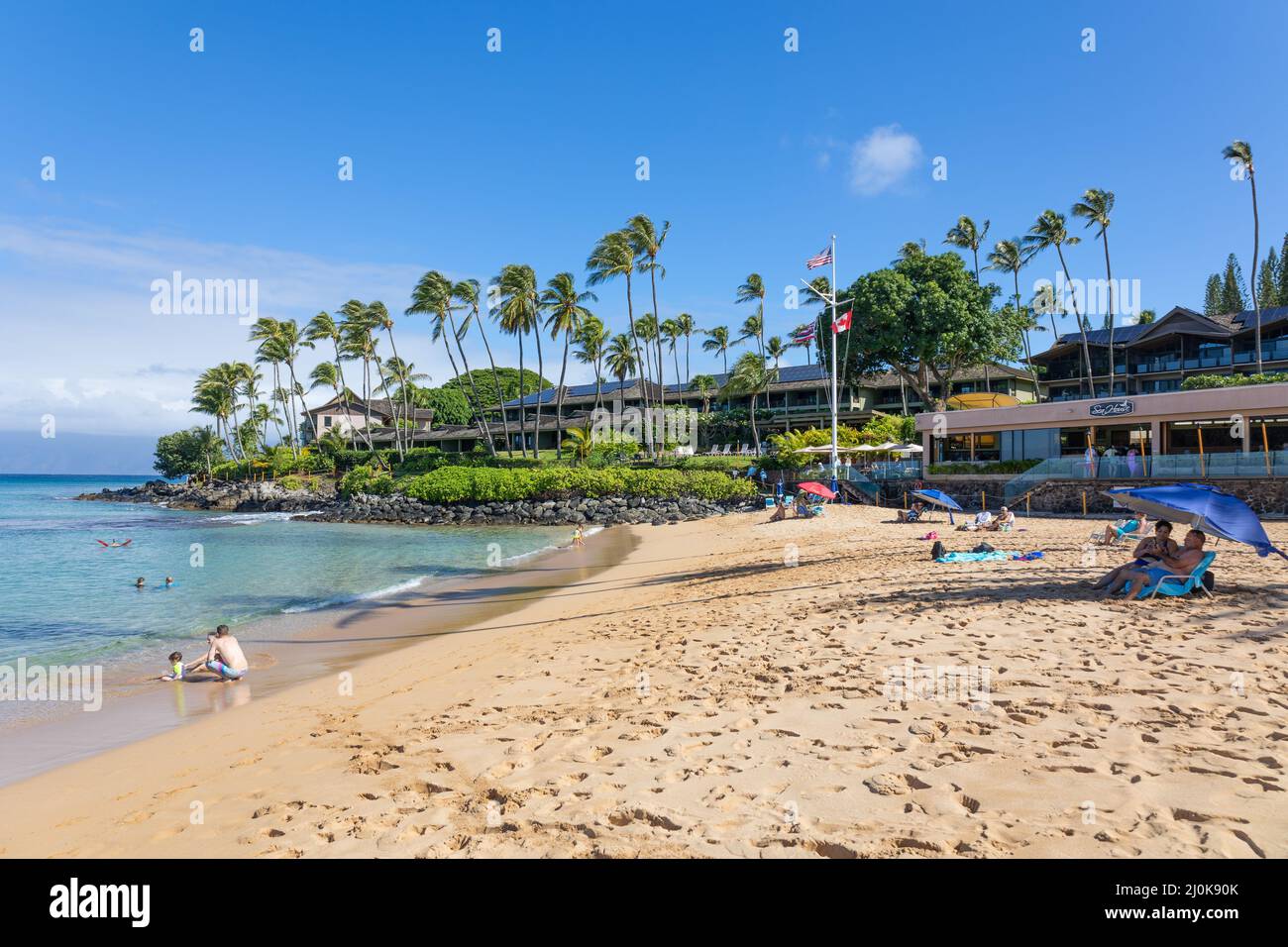Tourist enjoying tropical beach with white sand and crystal clear water