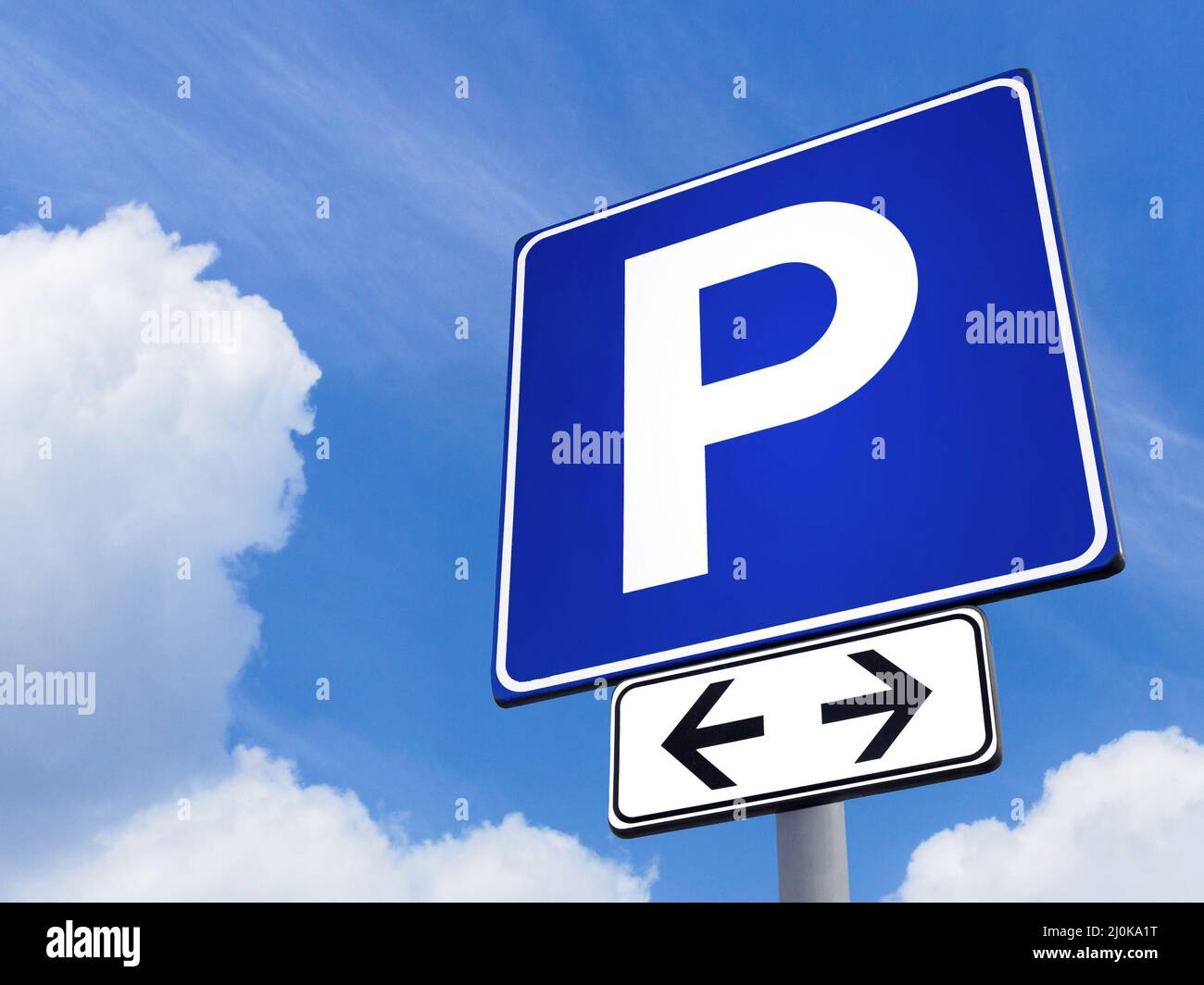 Parking signal with cloudy sky Stock Photo