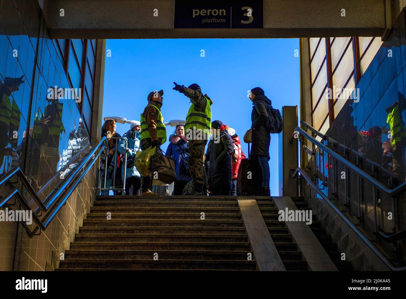Ukrainian refugees seen at a train station. Ukrainian refugees fleeing