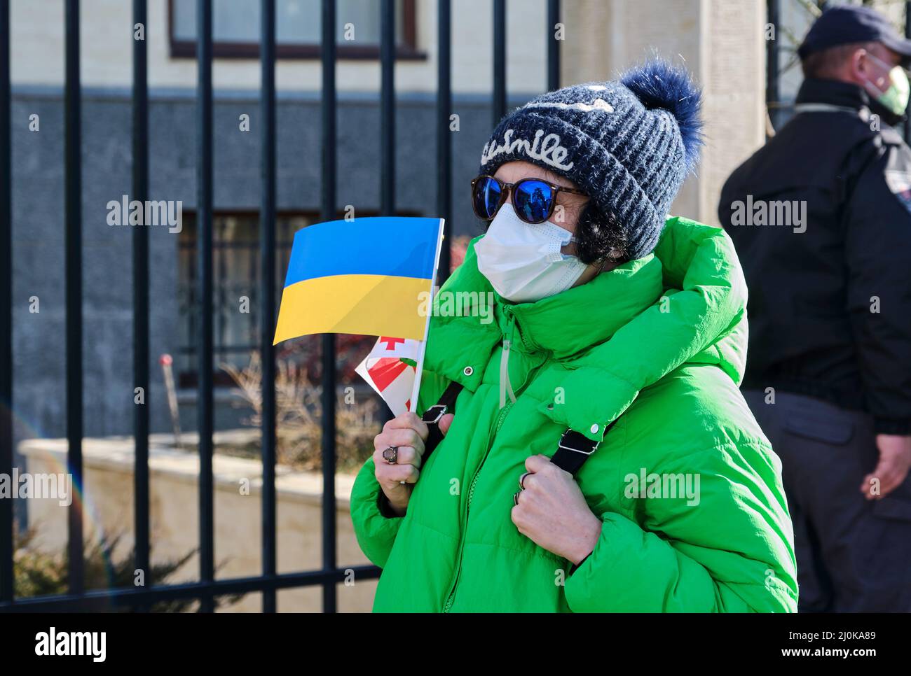 Russian protest against the war with Ukraine in Georgia near the Embassy of Ukraine. Woman with the flag of Ukraine. Georgia. Tbilisi Stock Photo