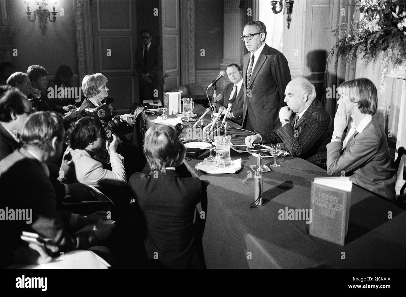 Henry Kissinger speaking at a press conference, answering questions ...
