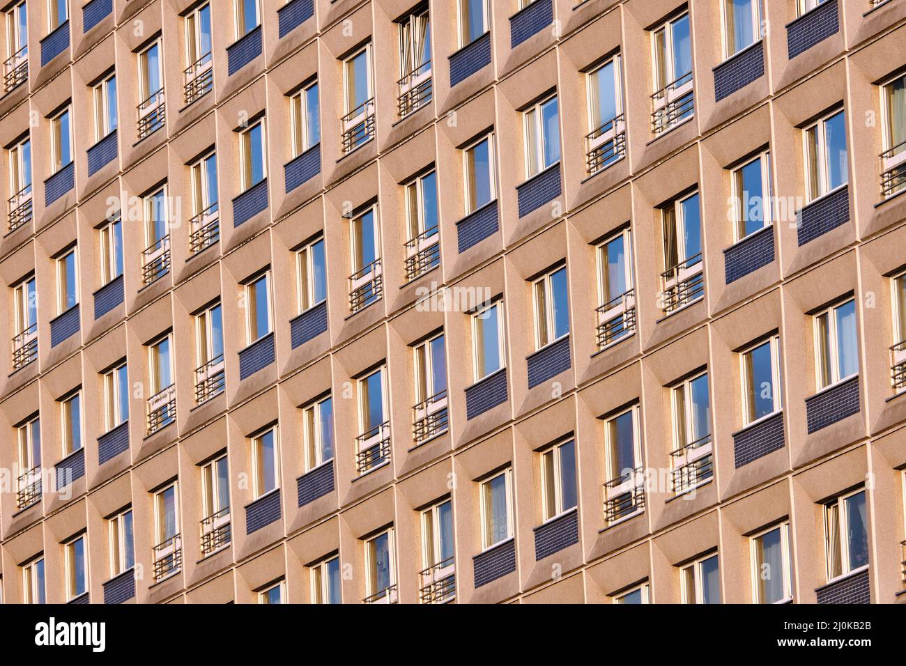 Facade of a typical precast apartment building in the former eastern part of Berlin, Germany Stock Photo