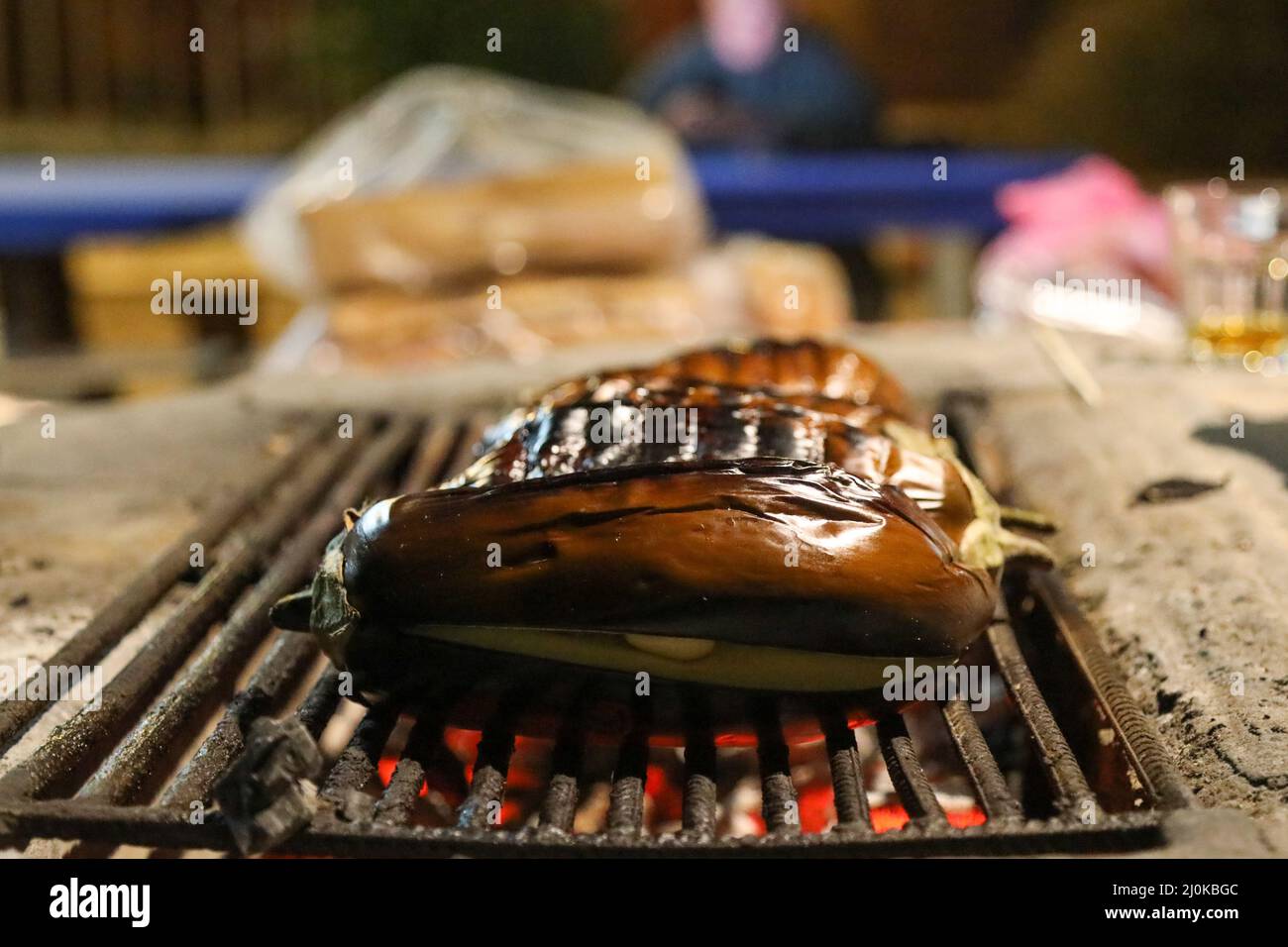 Eggplant group being cooked on a fireplace BBQ grill at the camping