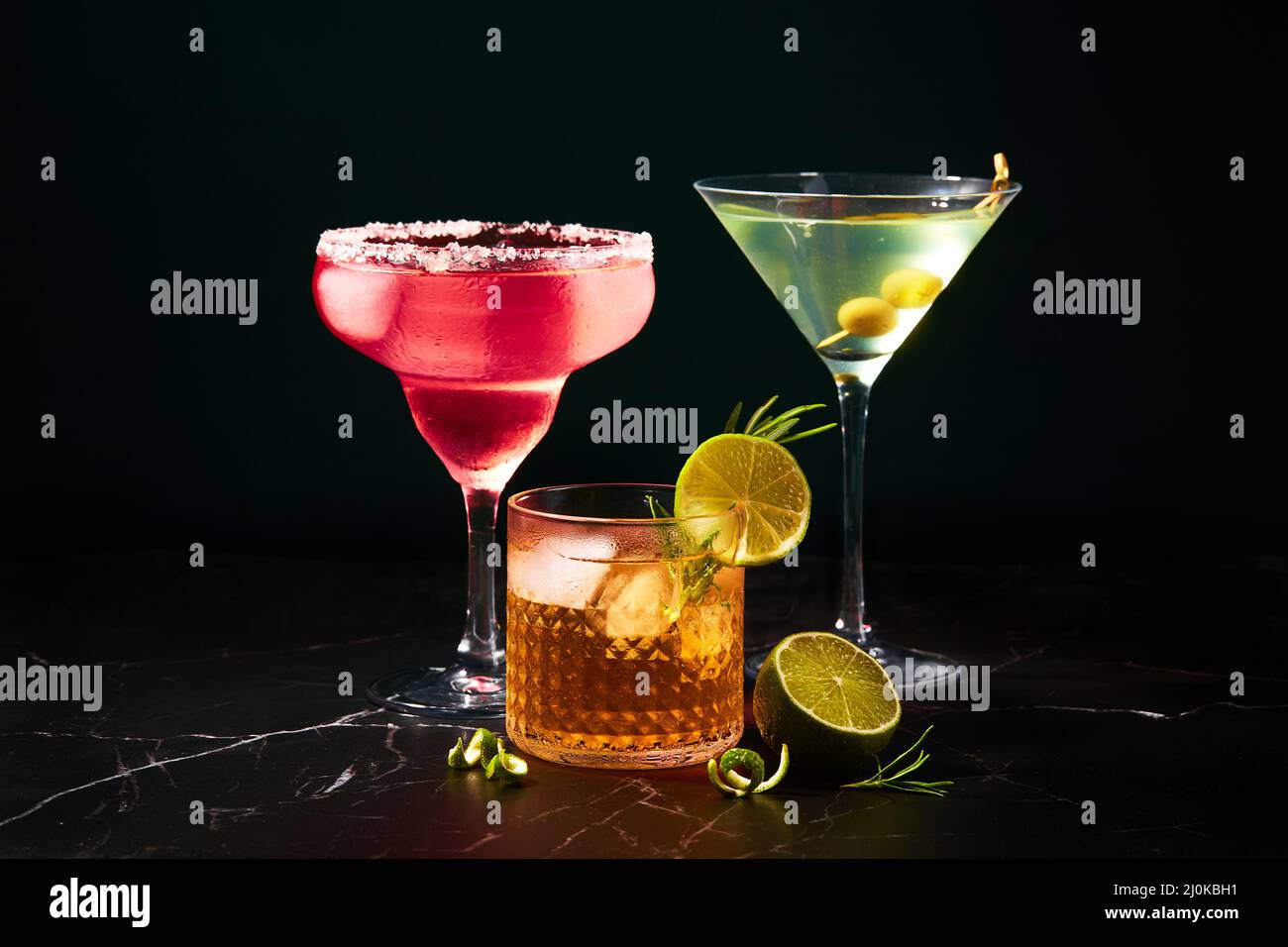 Alcoholic and non-alcoholic cocktails on a dark marble table. Summer refreshments Stock Photo