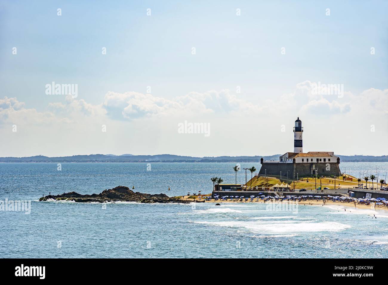 Barra beach and lighthouse with the summer sun of Salvador Stock Photo