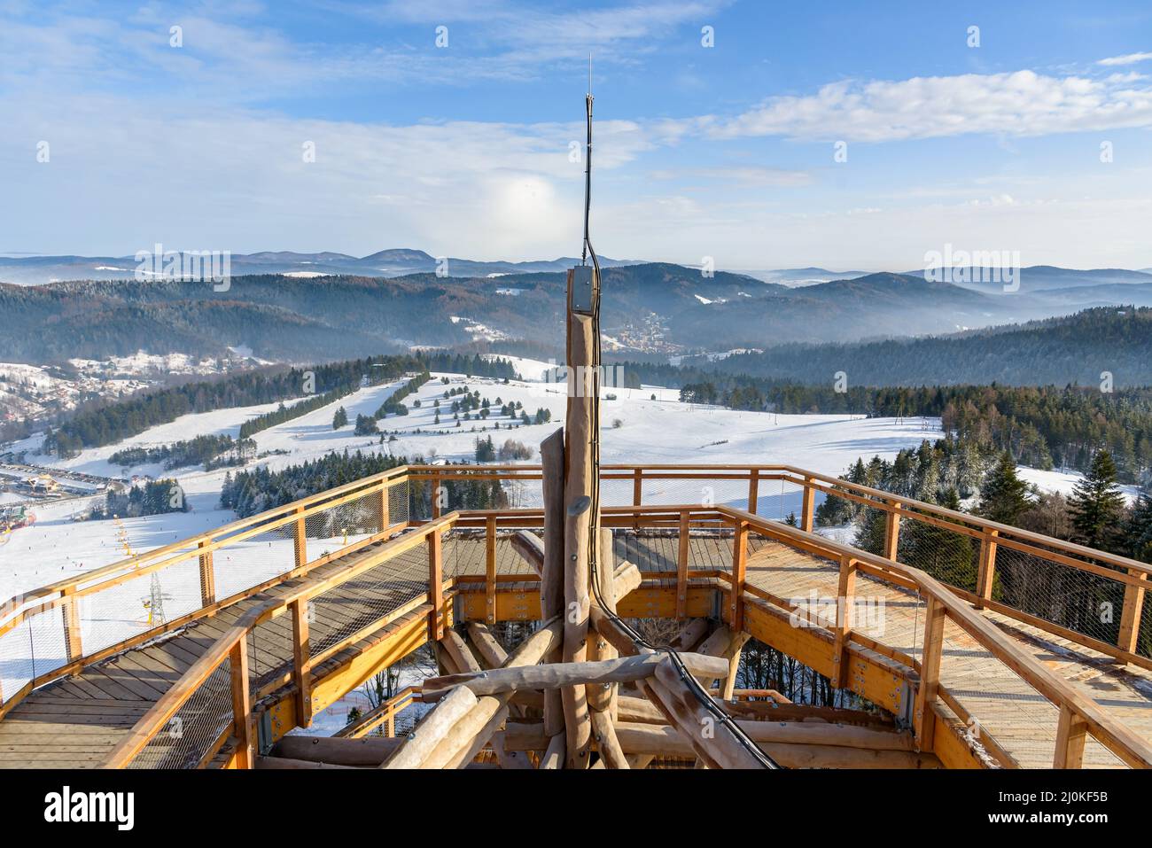 Beskid mountain winter landscape seen from the wooden path of the treetop observation tower at Slotwiny Arena ski station in Krynica Zdroj, Poland Stock Photo