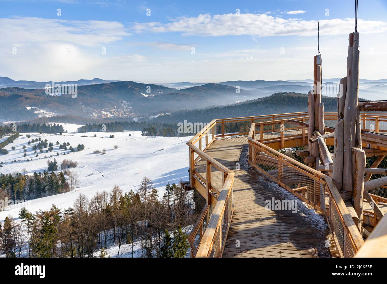 Beskid mountain winter landscape seen from the wooden path of the treetop observation tower at Slotwiny Arena ski station in Krynica Zdroj, Poland Stock Photo