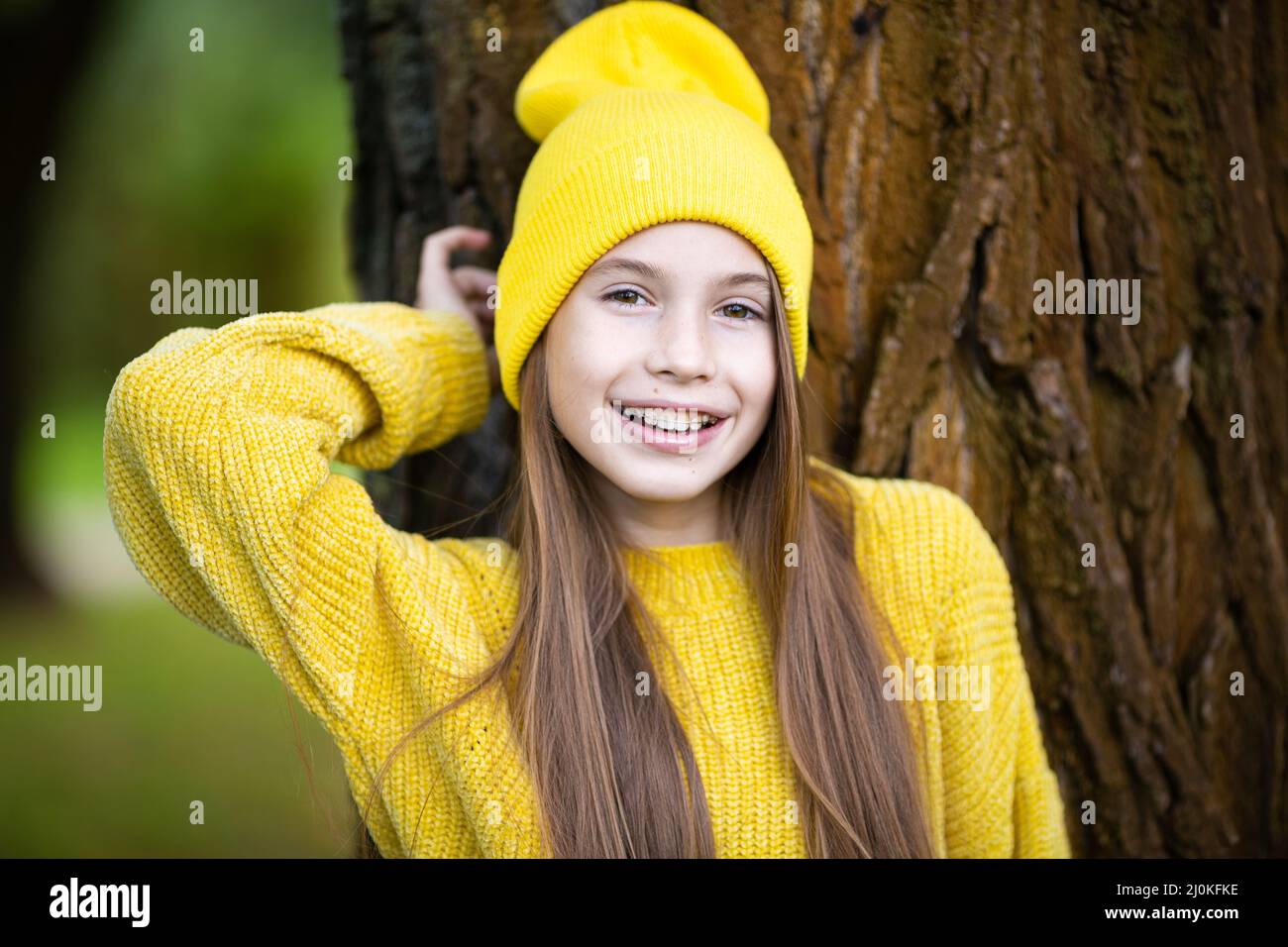 Pretty teenage girl wearing braces smiling cheerfully dressed in bright ...