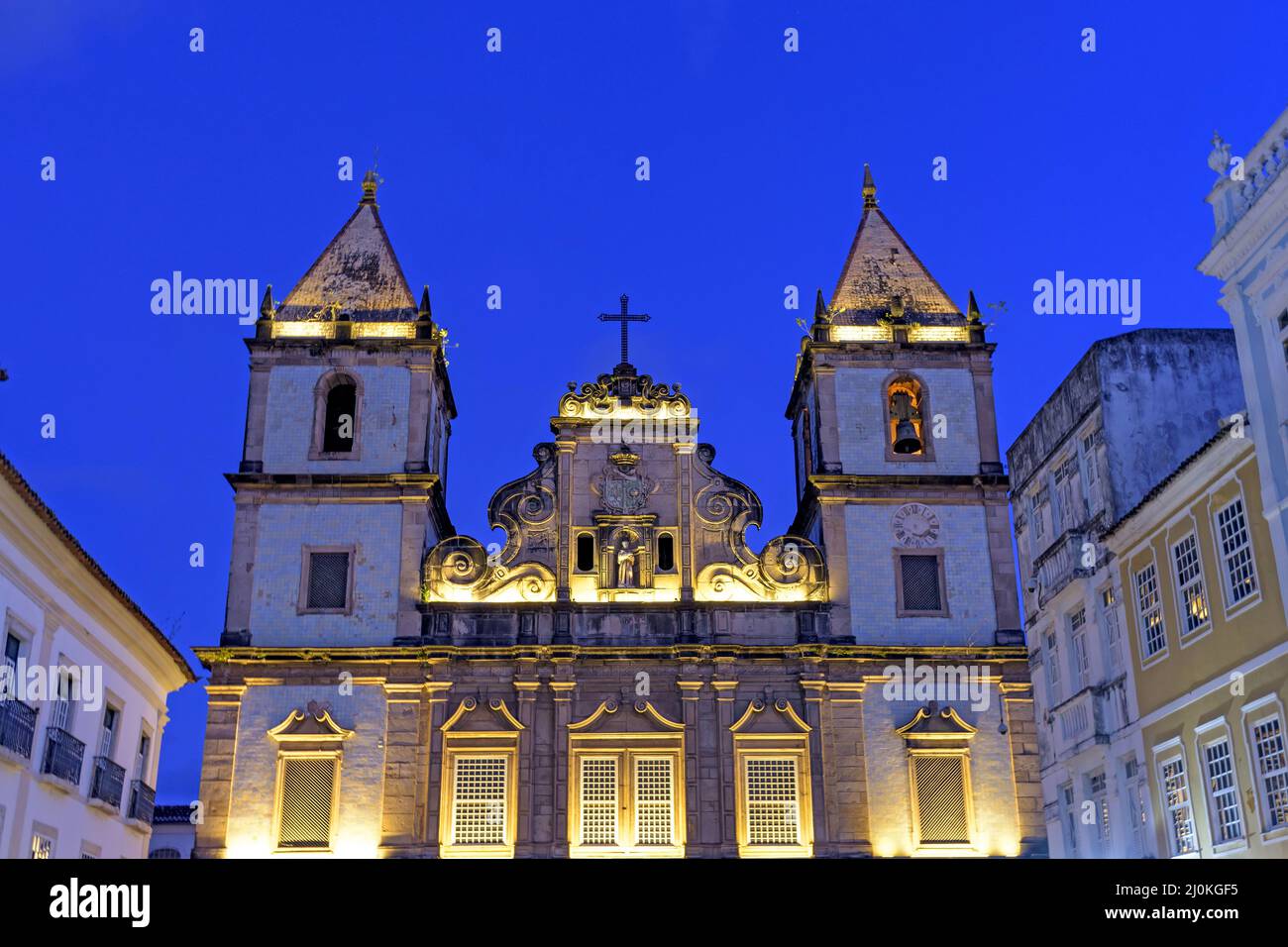Illuminated facade of an ancient and historic church located in Salvador, Bahia Stock Photo