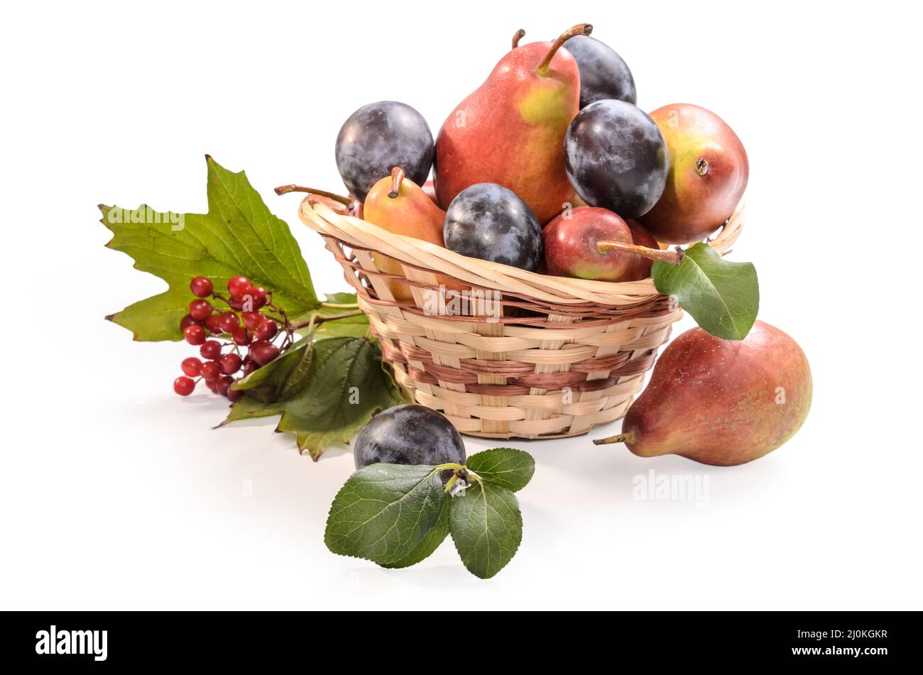 Fruits and berries in a basket on a white background with soft shadow Stock Photo