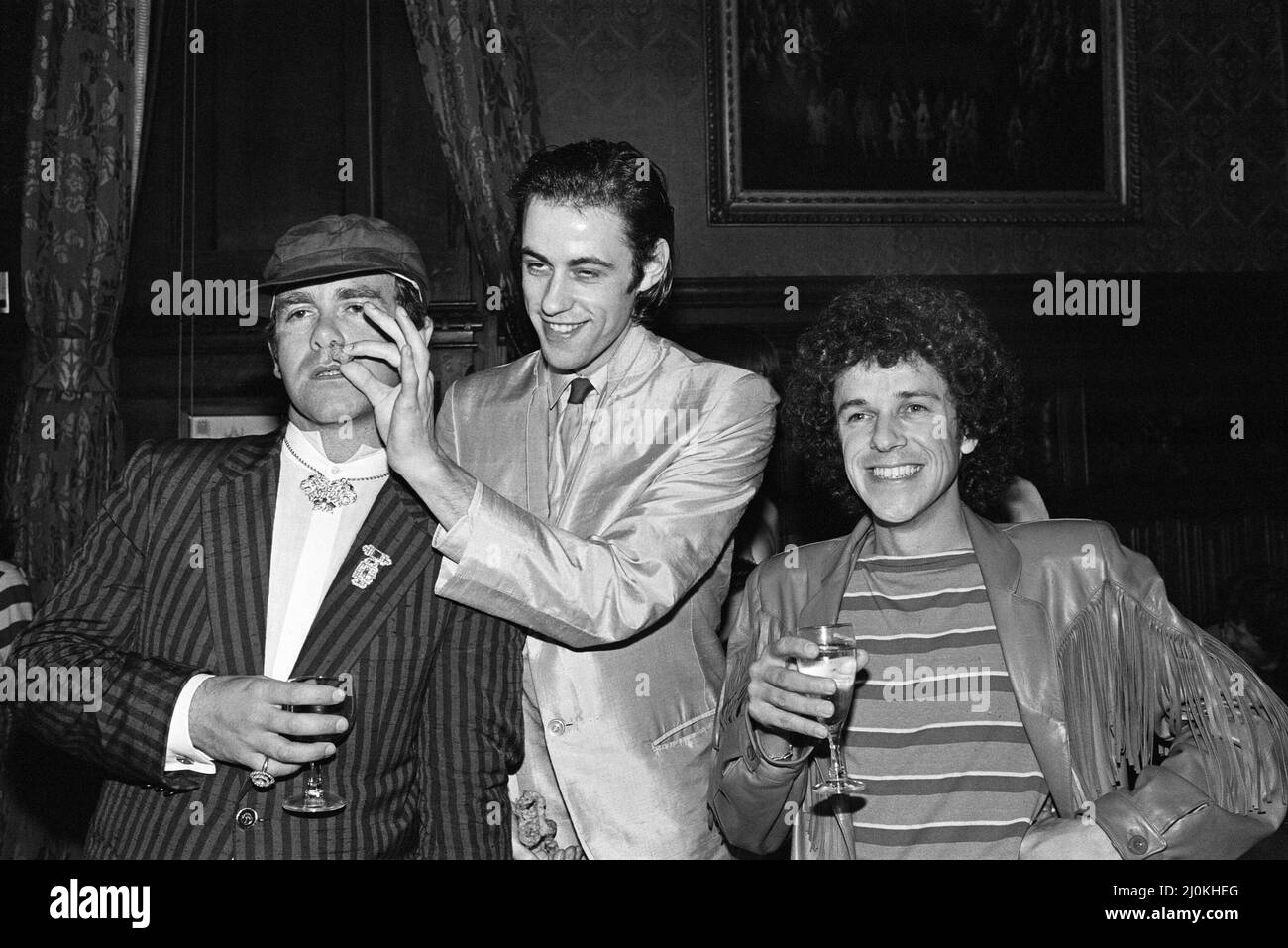 Elton John, Bob Geldof and Leo Sayer attending a House of Commons reception, invited along with other pop stars by the Minister for the Arts, Norman St John-Stevas. 3rd August 1980. Stock Photo