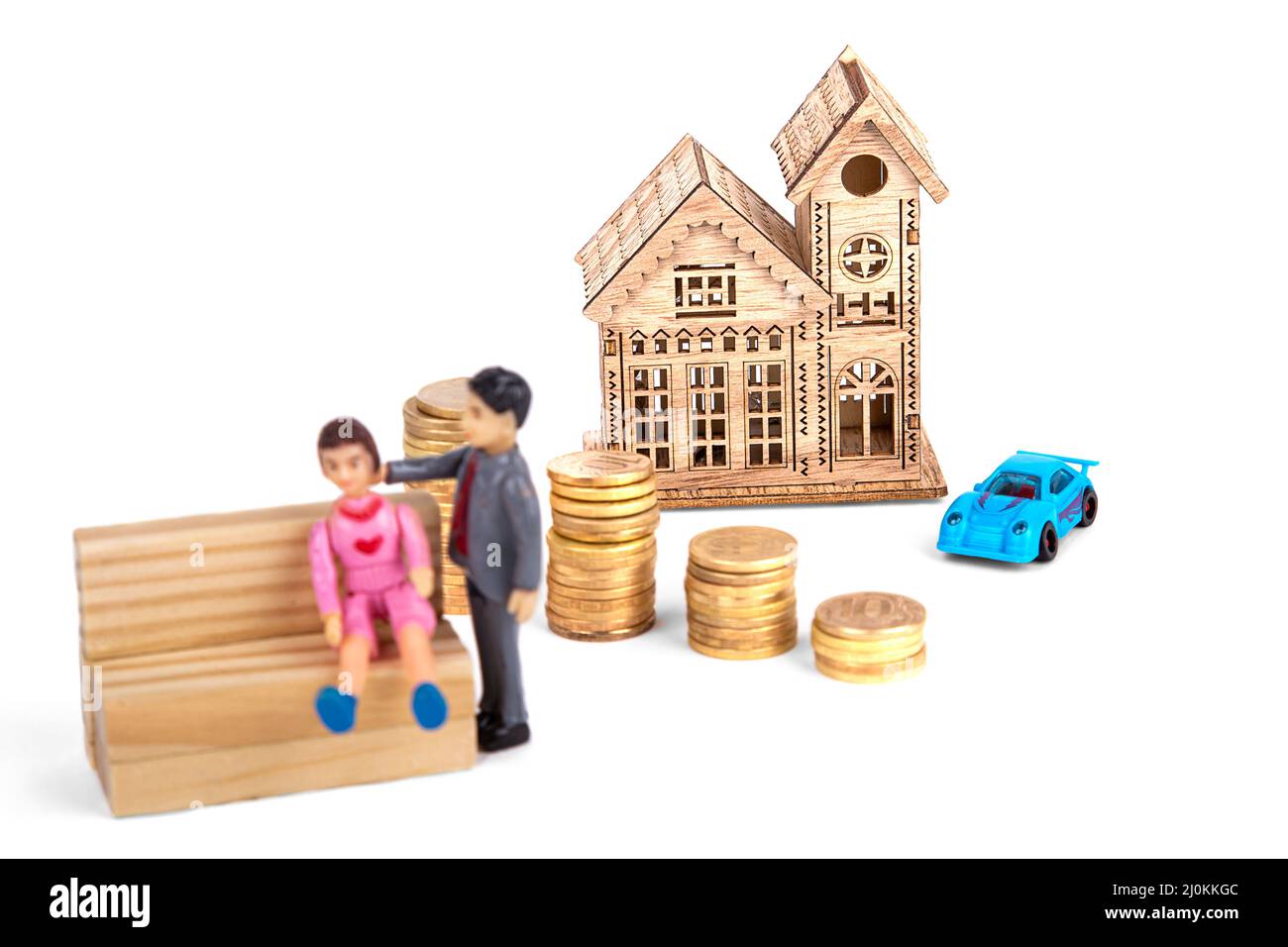 Blurred figures of people, against the background of a wooden house with a car and stacks of coins, on a white background Stock Photo
