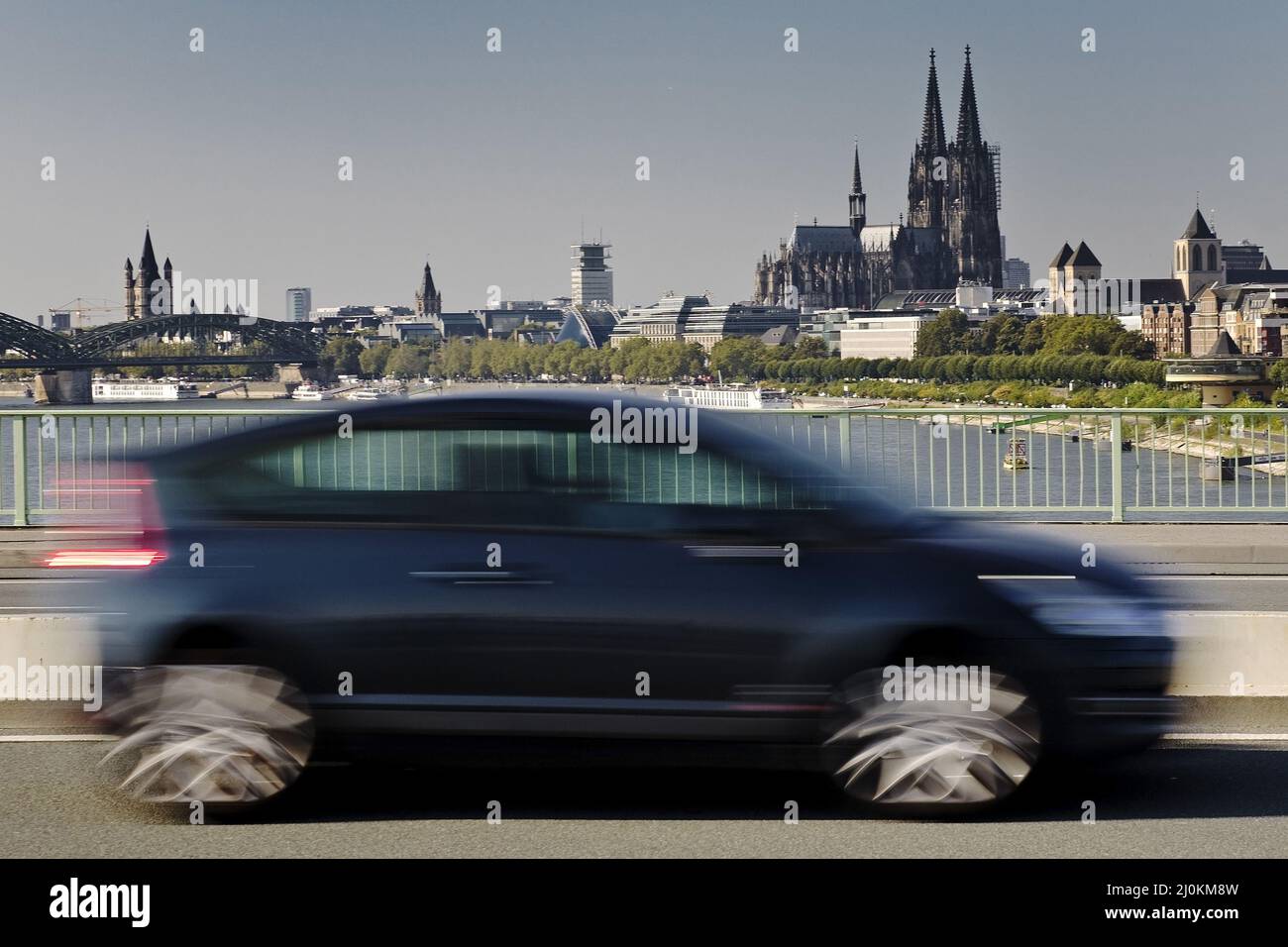 Car in motion on the Zoo bridge with the cathedral in the background, Cologne, Germany, Europe Stock Photo