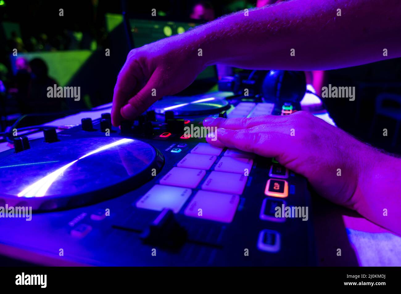 Male hands turning a button in the DJ mixer Stock Photo Alamy
