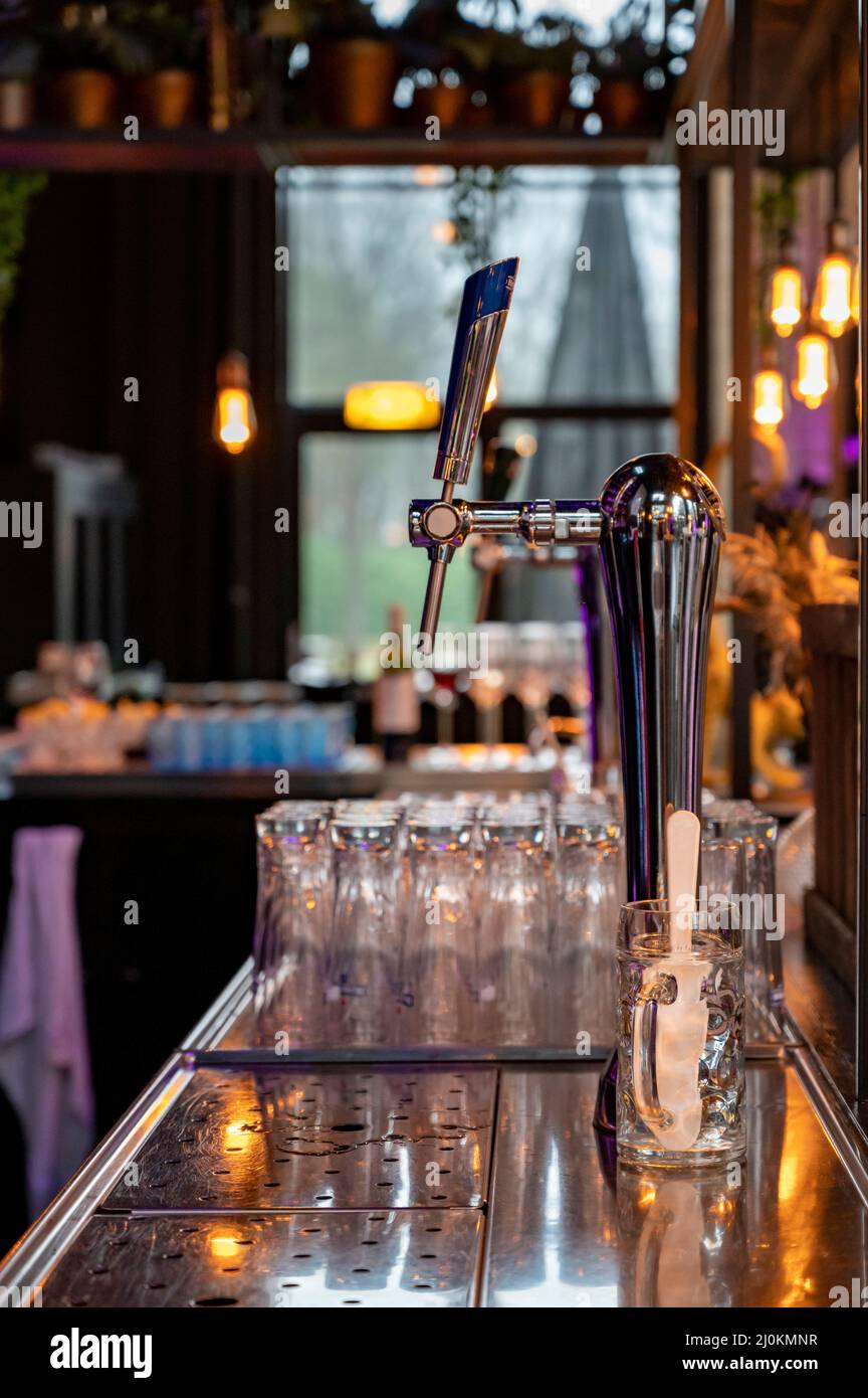 Interior of classic beer and whisky bar with beer taps and empty