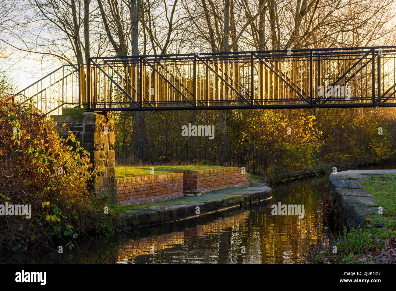 Footbridge over the Ashton Canal at sunrise, Droylsden, Tameside, Manchester, UK Stock Photo