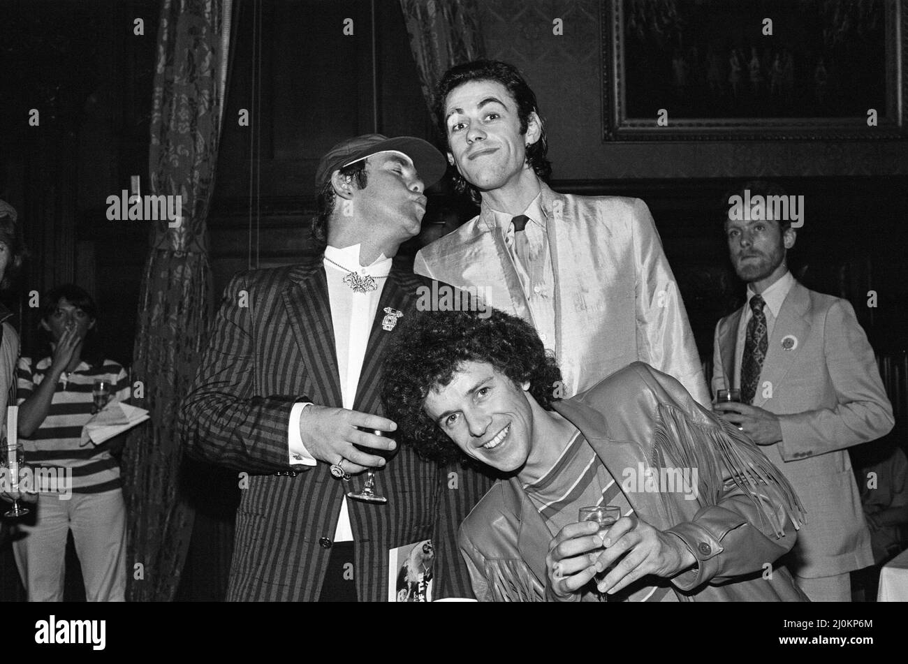 Elton John, Bob Geldof and Leo Sayer attending a House of Commons reception, invited along with other pop stars by the Minister for the Arts, Norman St John-Stevas. 3rd August 1980. Stock Photo