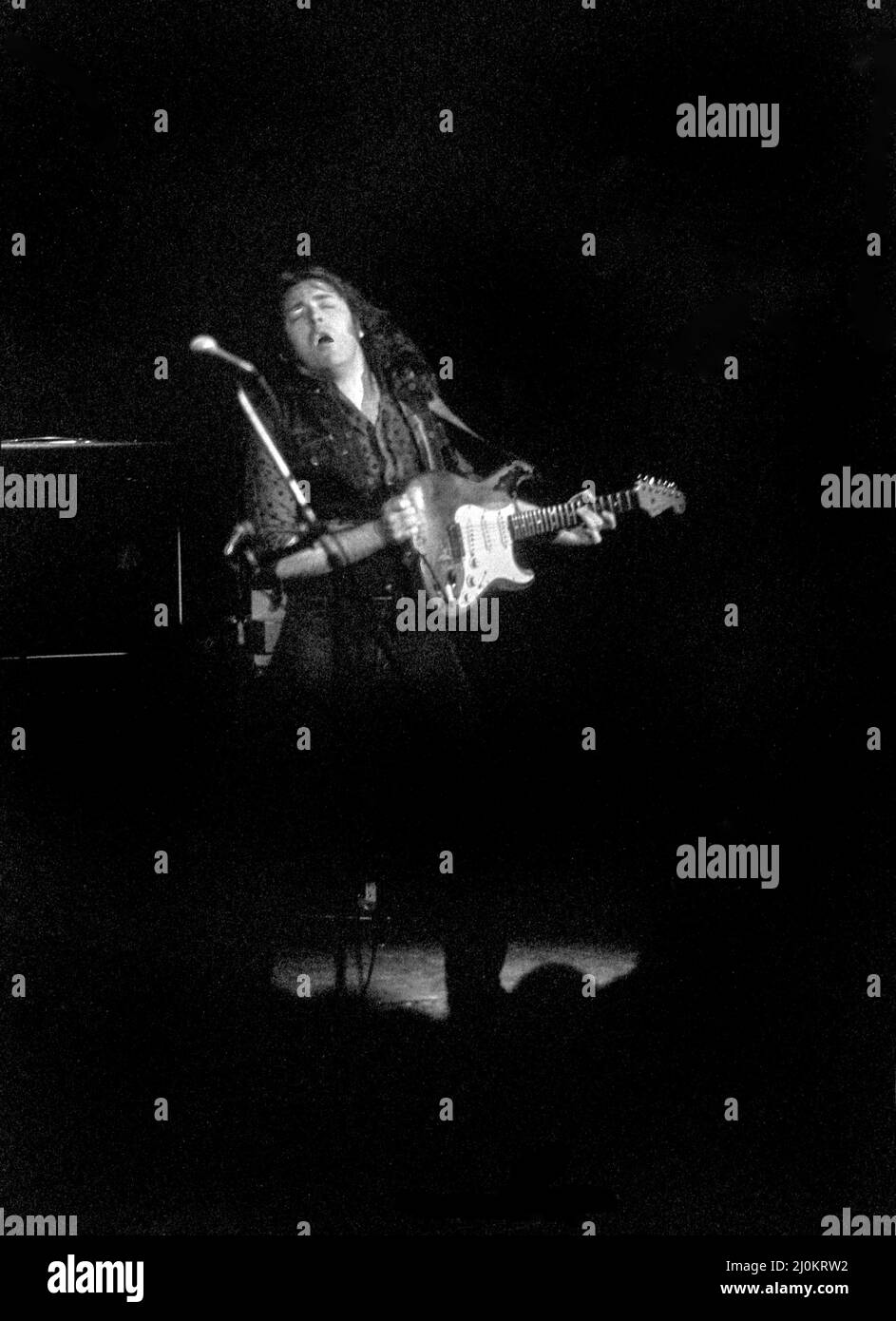 Irish blues/rock guitarist and singer Rory Gallagher at the Rainbow Theatre, London, England in October 1980. Stock Photo