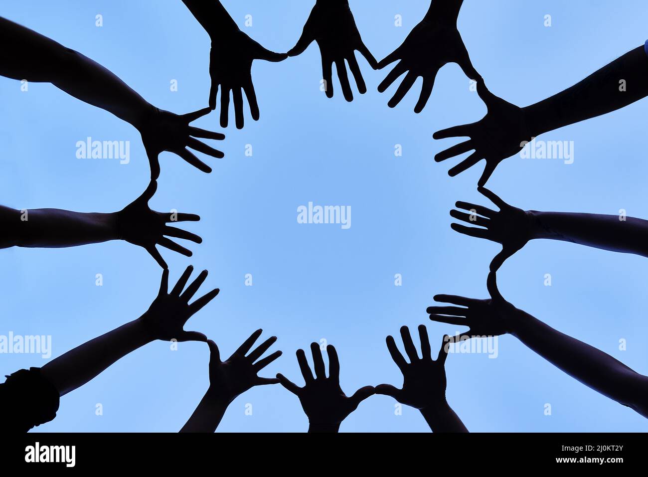 Collaborating as one. Shot of a group of hands spread out together in a circle Stock Photo Alamy
