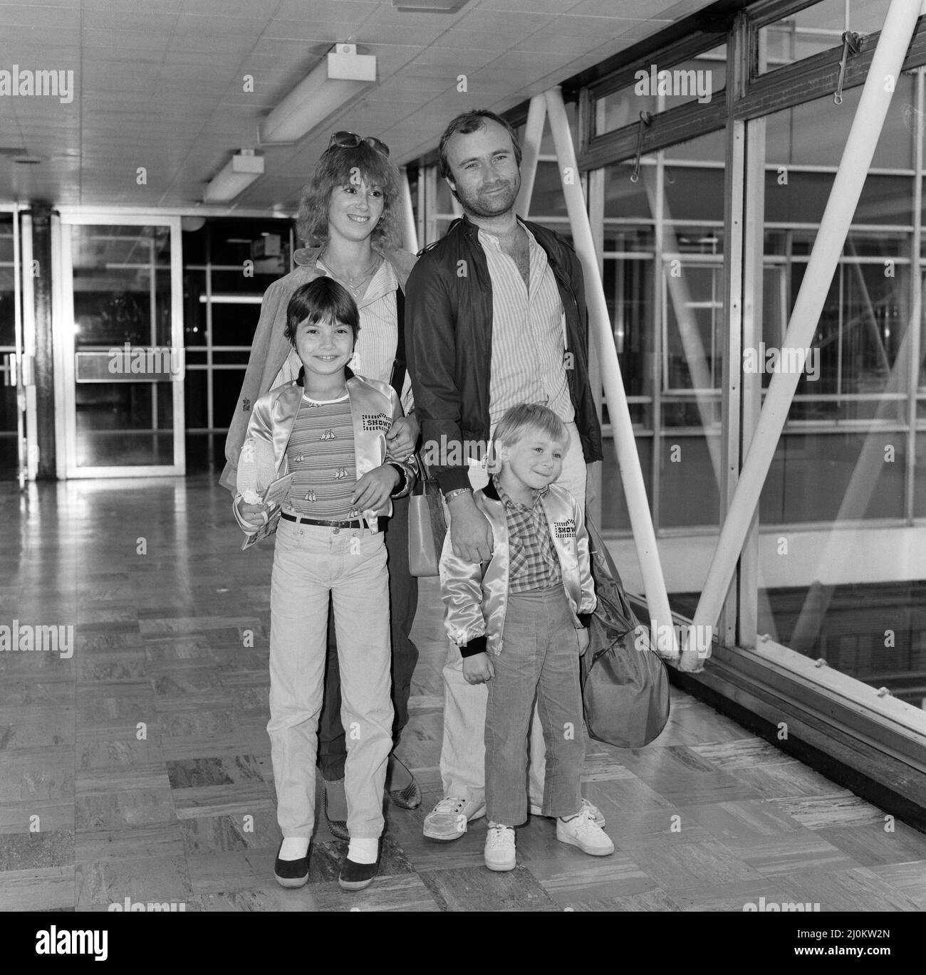 Phil Collins of pop group Genesis, with girlfriend Jill Tavelman and his children 10-year old Joely and 5-year-old Simon for a months tour of the states. 28th July 1982. Stock Photo