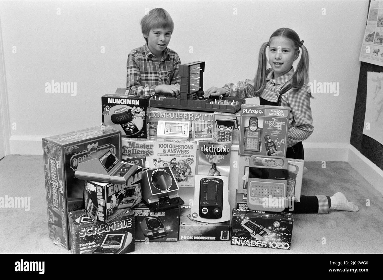 Two lucky children surrounded by a selection of electronic games available in the shops this year. 8th December 1982. Stock Photo