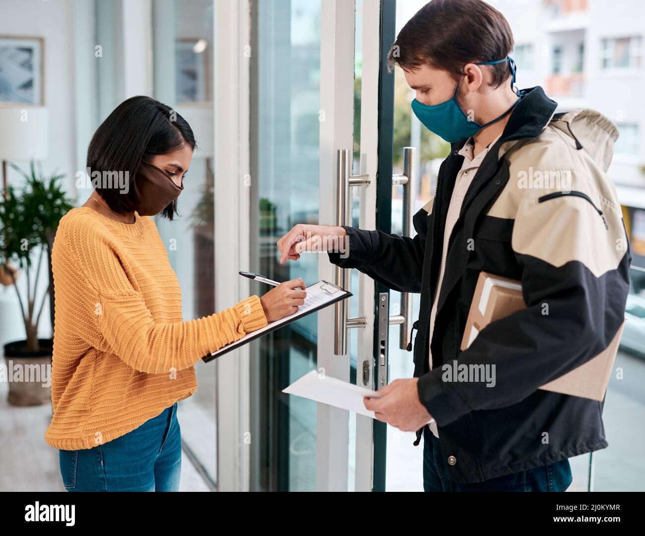Just your signature and its all yours. Shot of a masked young woman ...