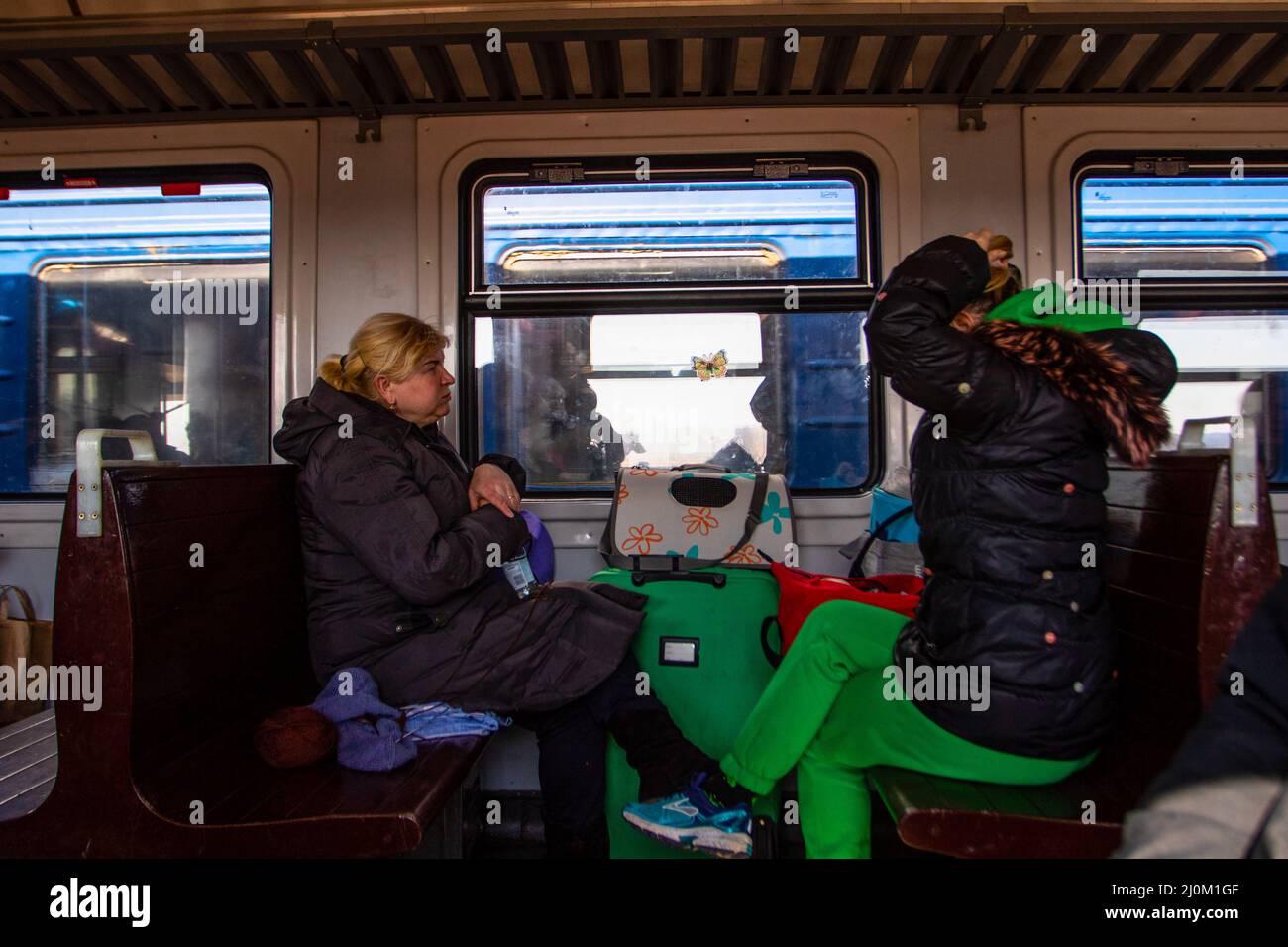 Przemysl, Poland. 19th Mar, 2022. People ride in a train heading to Lviv. Ukrainians return to Ukraine from Poland by train. Some were returning after being unable to find resource in Poland others where going back to help their families. Credit: SOPA Images Limited/Alamy Live News Stock Photo