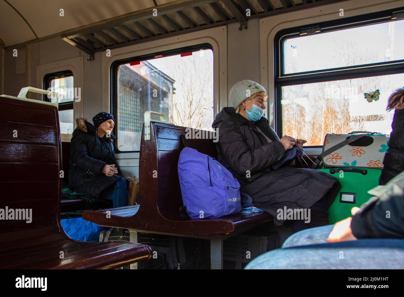 Przemysl, Poland. 19th Mar, 2022. People ride in a train heading to Lviv. Ukrainians return to Ukraine from Poland by train. Some were returning after being unable to find resource in Poland others where going back to help their families. (Photo by Ty O'Neil/SOPA Images/Sipa USA) Credit: Sipa USA/Alamy Live News Stock Photo