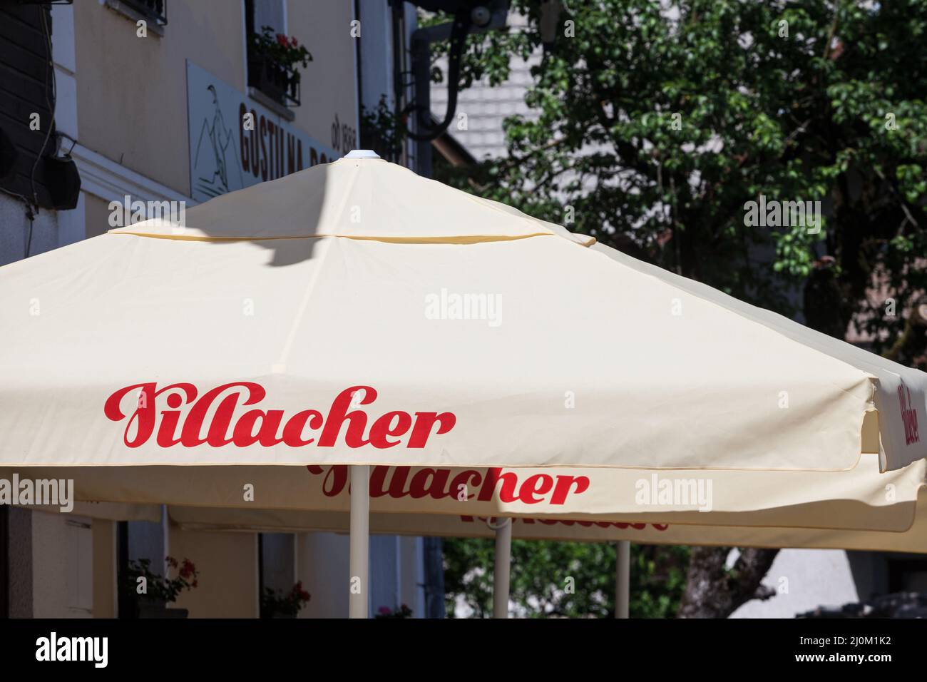 Picture of a sign with the logo of Villacher Beer taken on a cafe in Villach, Austria.  Villacher beer is the main brand of Villacher Brewery in Villa Stock Photo