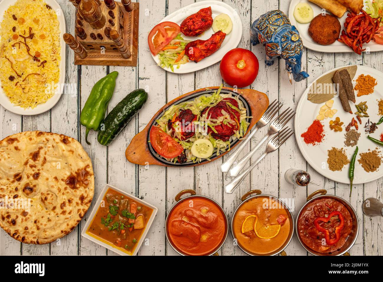 Typical Indian food dishes with many curries, mild and strong, naan