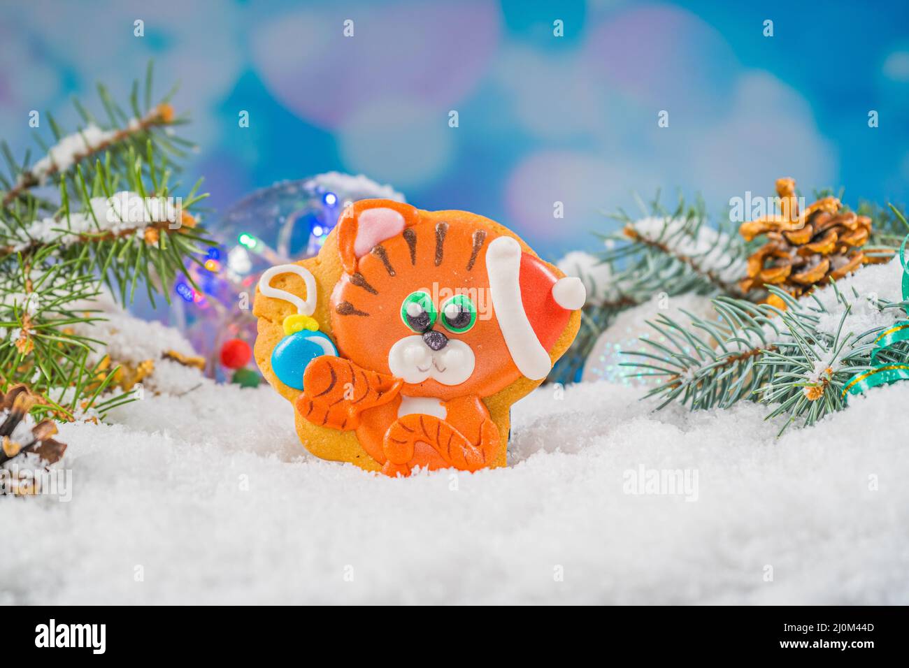 Christmas background with tiger gingerbread 2022. Holiday mood card. Family traditions, DIY, celebration concept. Festive backgr Stock Photo