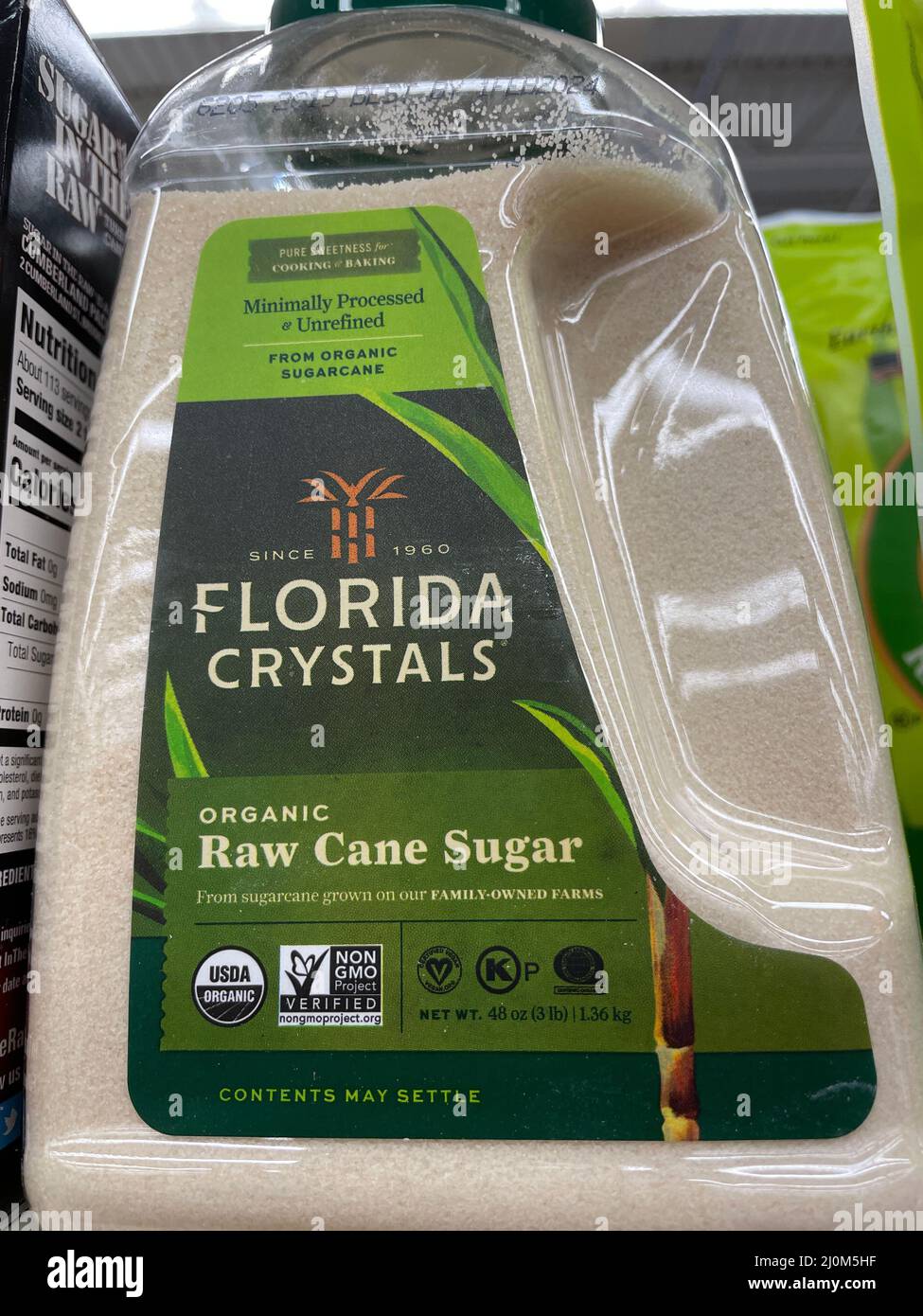 Grovetown, Ga USA - 03 13 22: Artificial sweeteners on retail store shelf Florida Crystals raw cane sugar Stock Photo