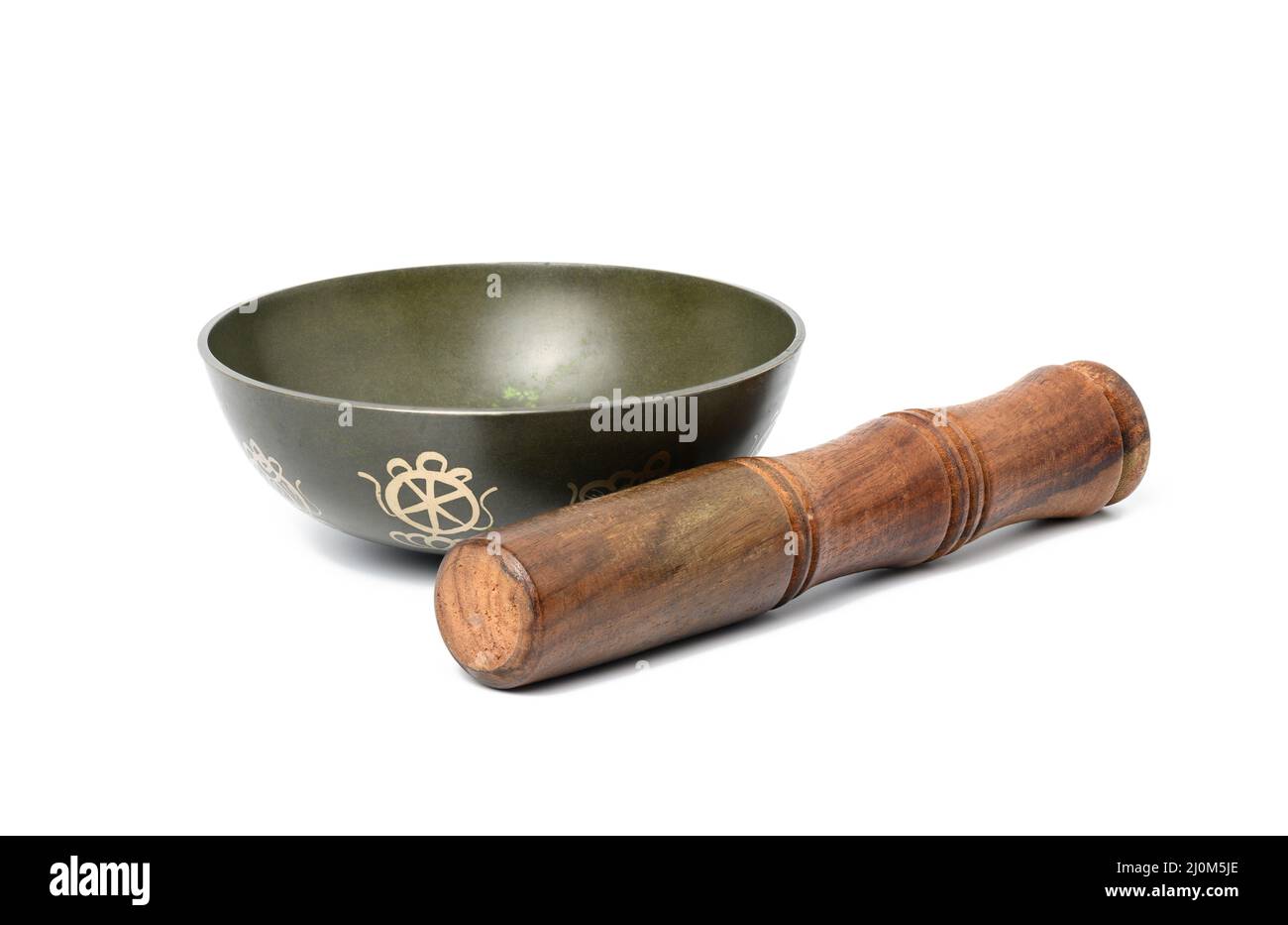Copper singing bowl and wooden mallet isolated on white background