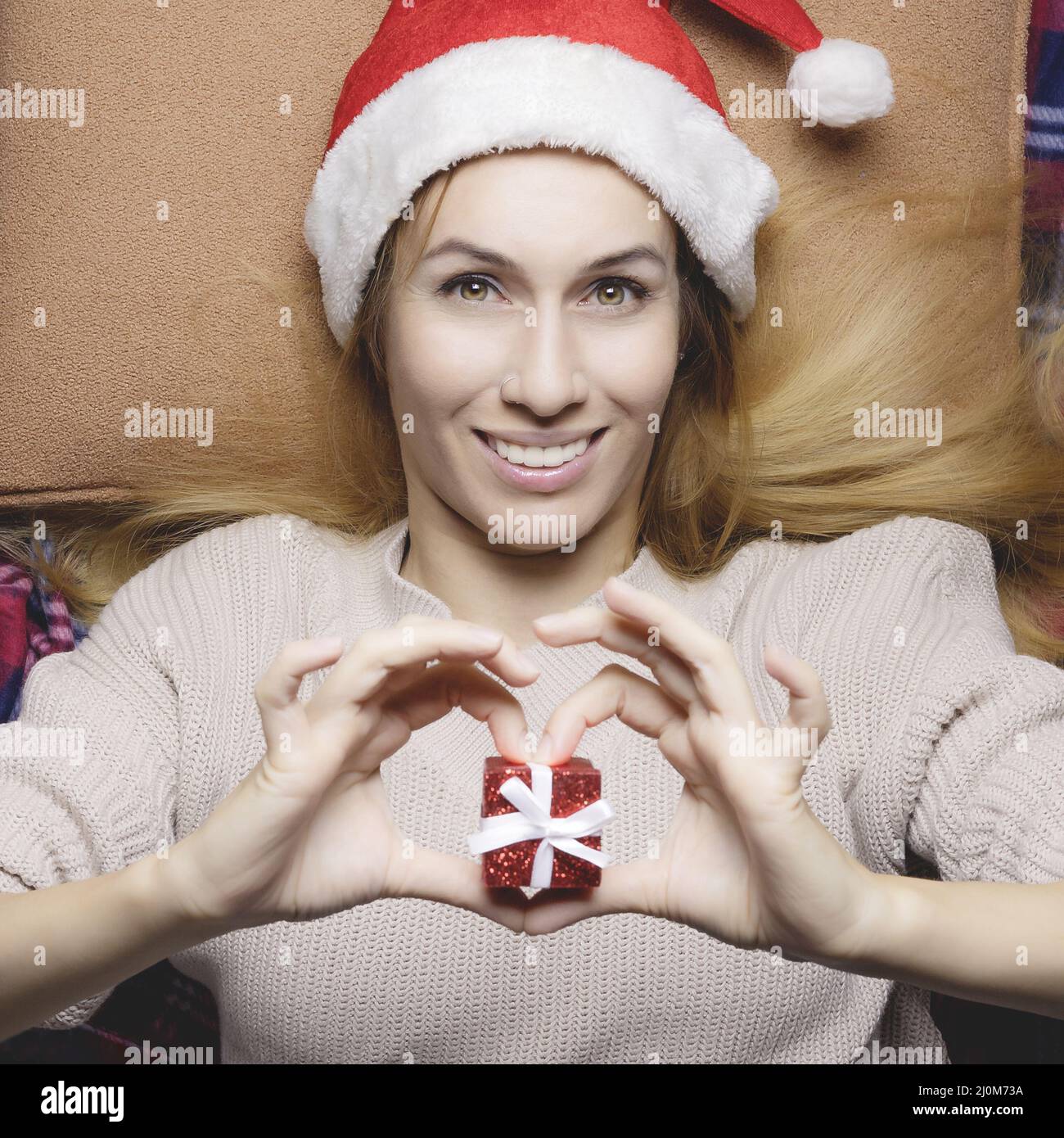 Christmas Eve. Girl with a Christmas present. Festive mood. Thematic image Stock Photo