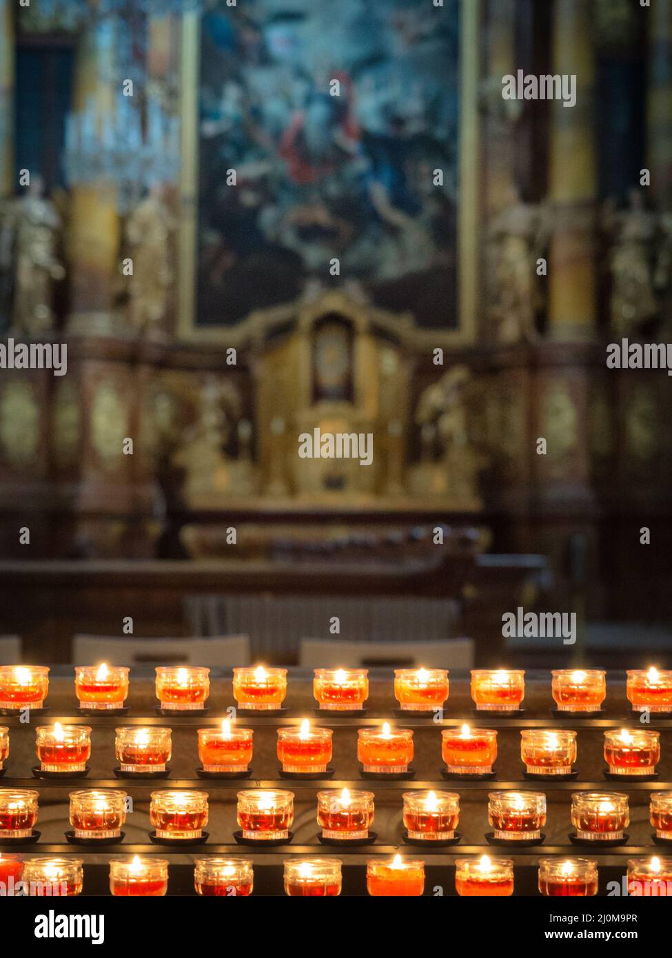 Candles in a church background Stock Photo - Alamy