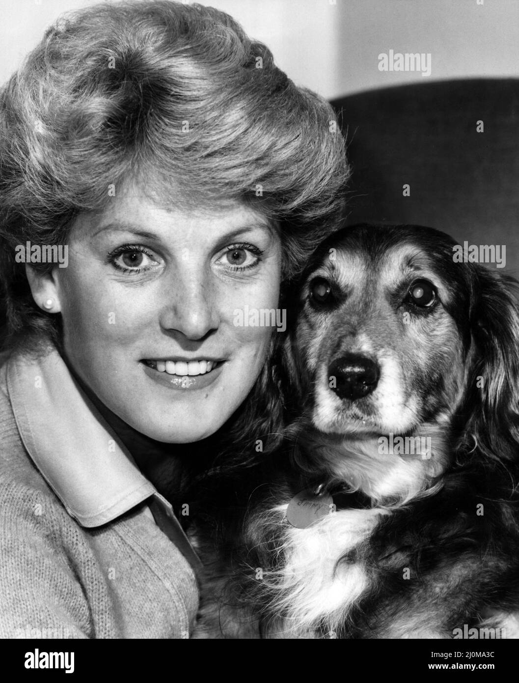 Scottish singer Moira Anderson with her dog Jimmy, who she found 3 years ago lying on the roadside having been the victim of a hit and run driver. Circa 1981 Stock Photo