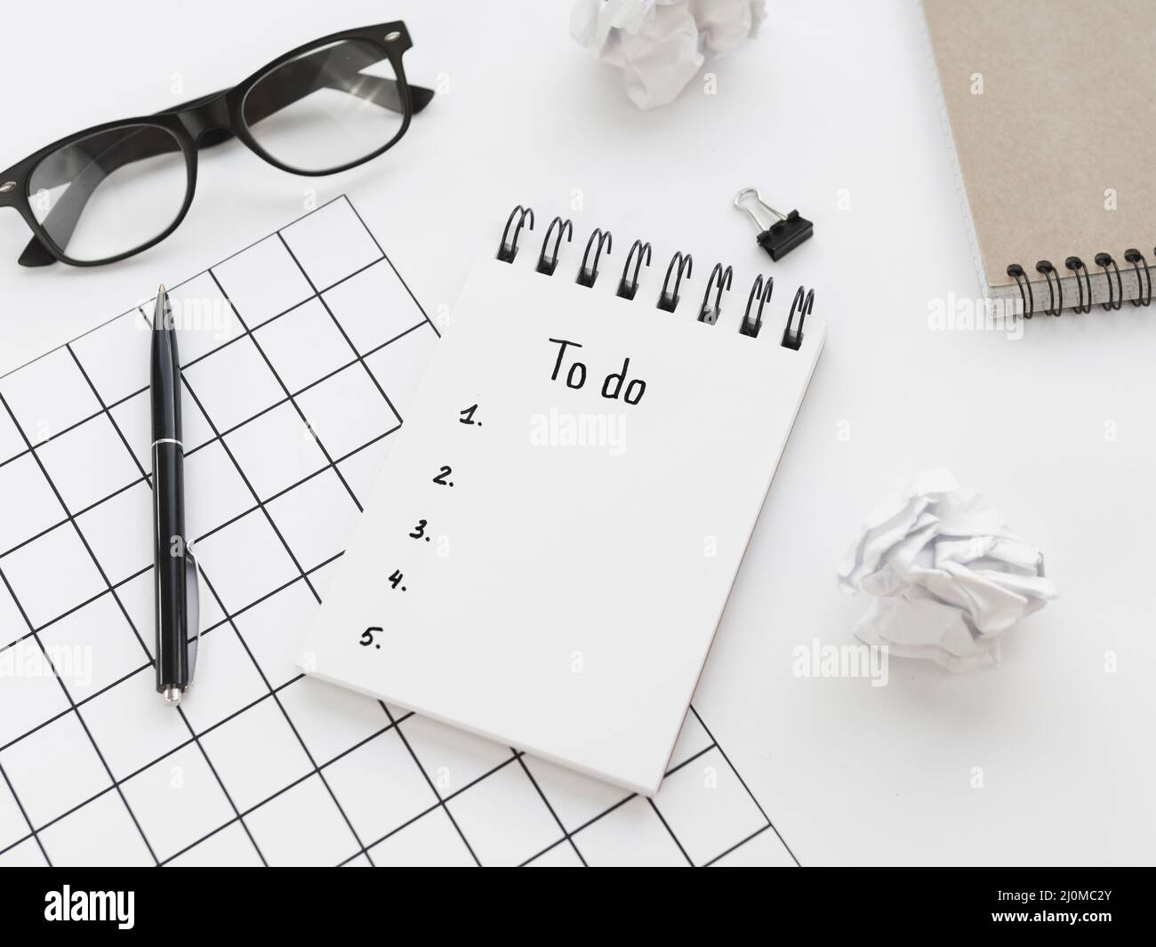 High angle list notepad with glasses pen Stock Photo