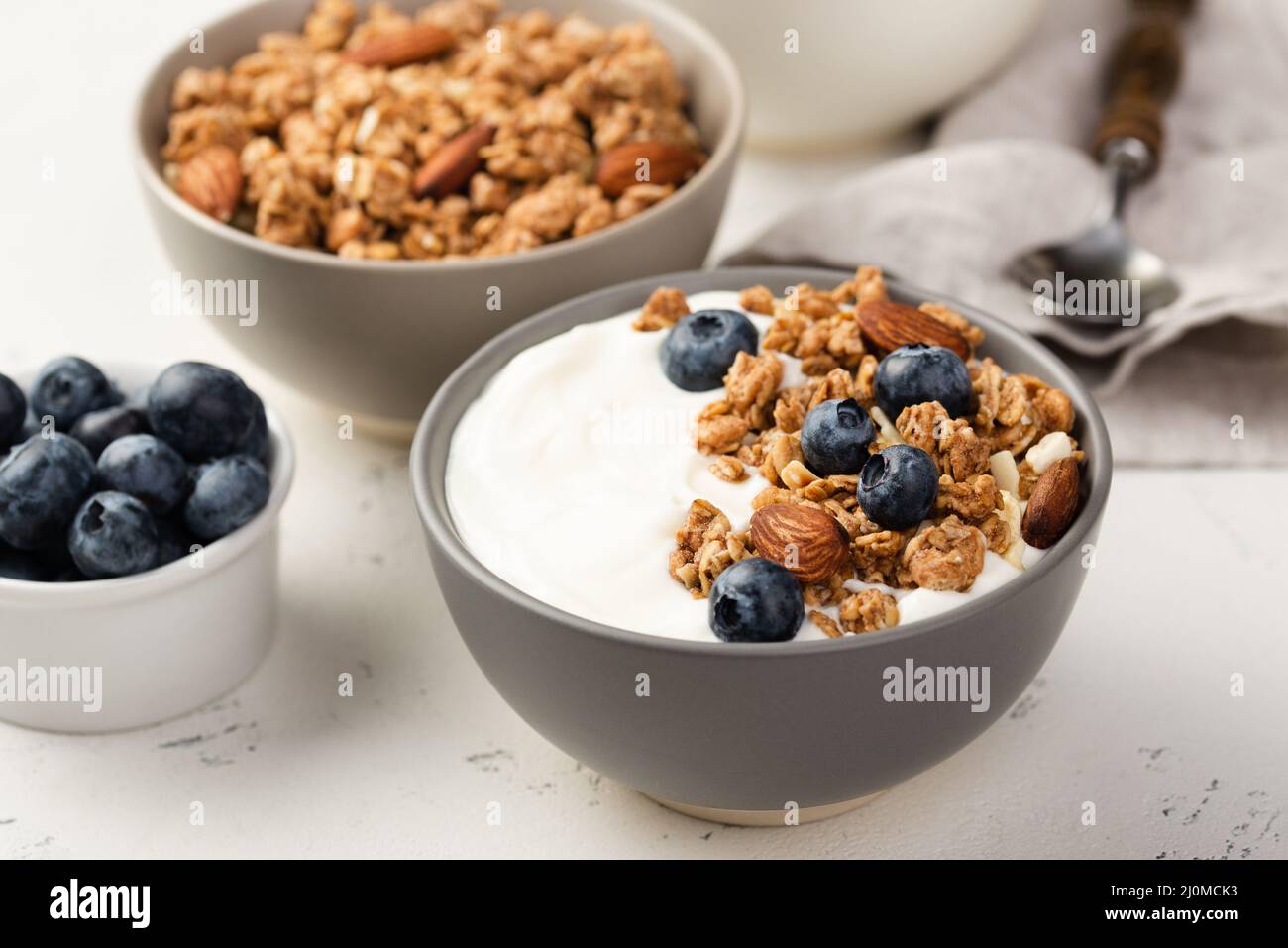 High angle bowls breakfast cereal with blueberries yogurt Stock Photo