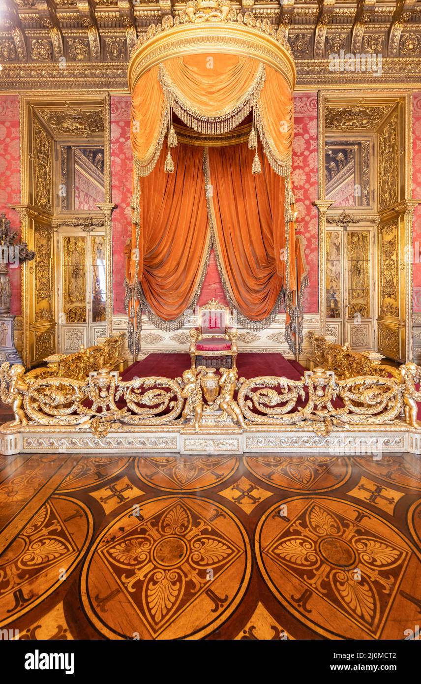 old throne room interior with chair in luxury palace red and gold antique baroque style 2J0MCT2